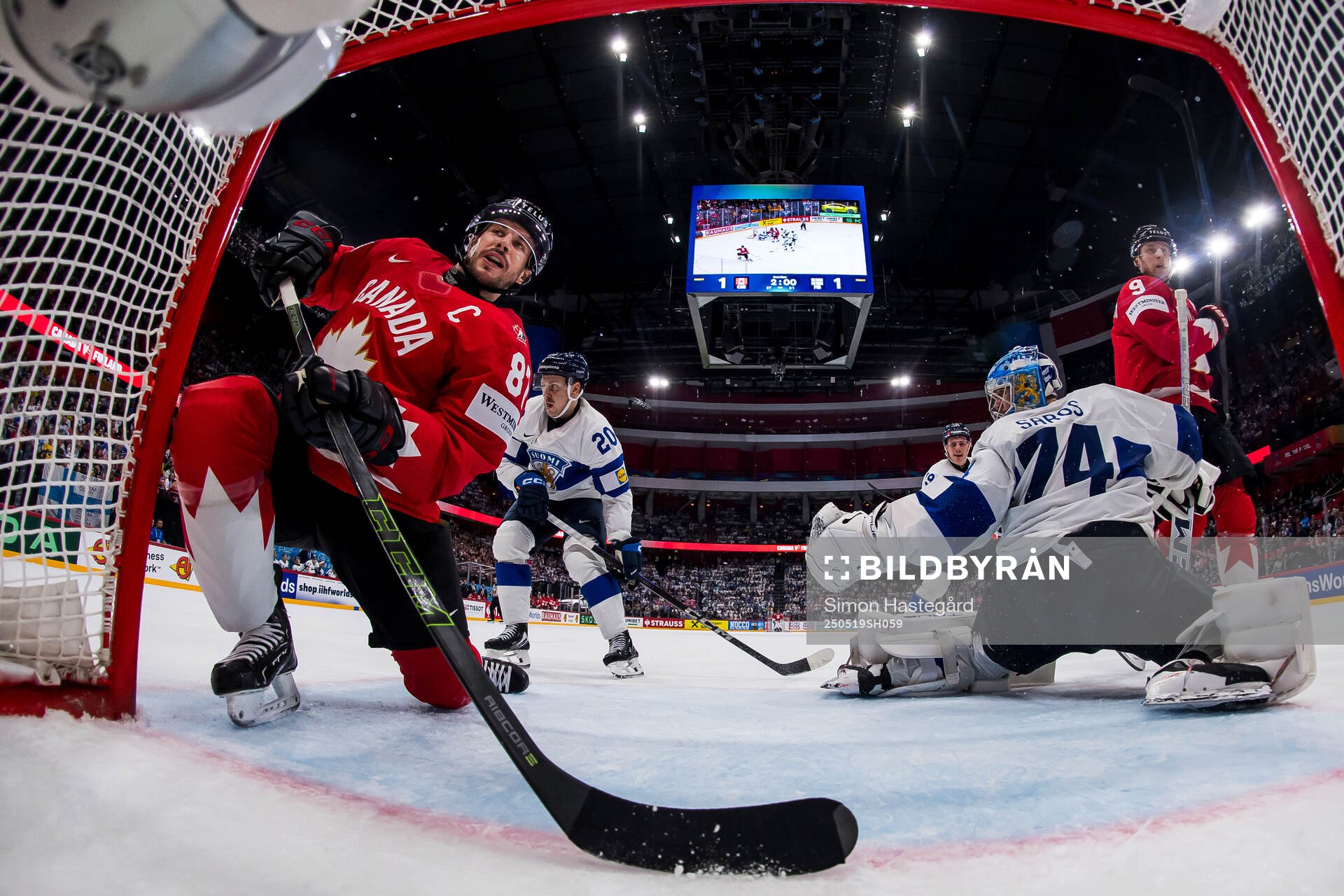 Sidney Crosby and Nathan MacKinnon of Canada against Eeli
