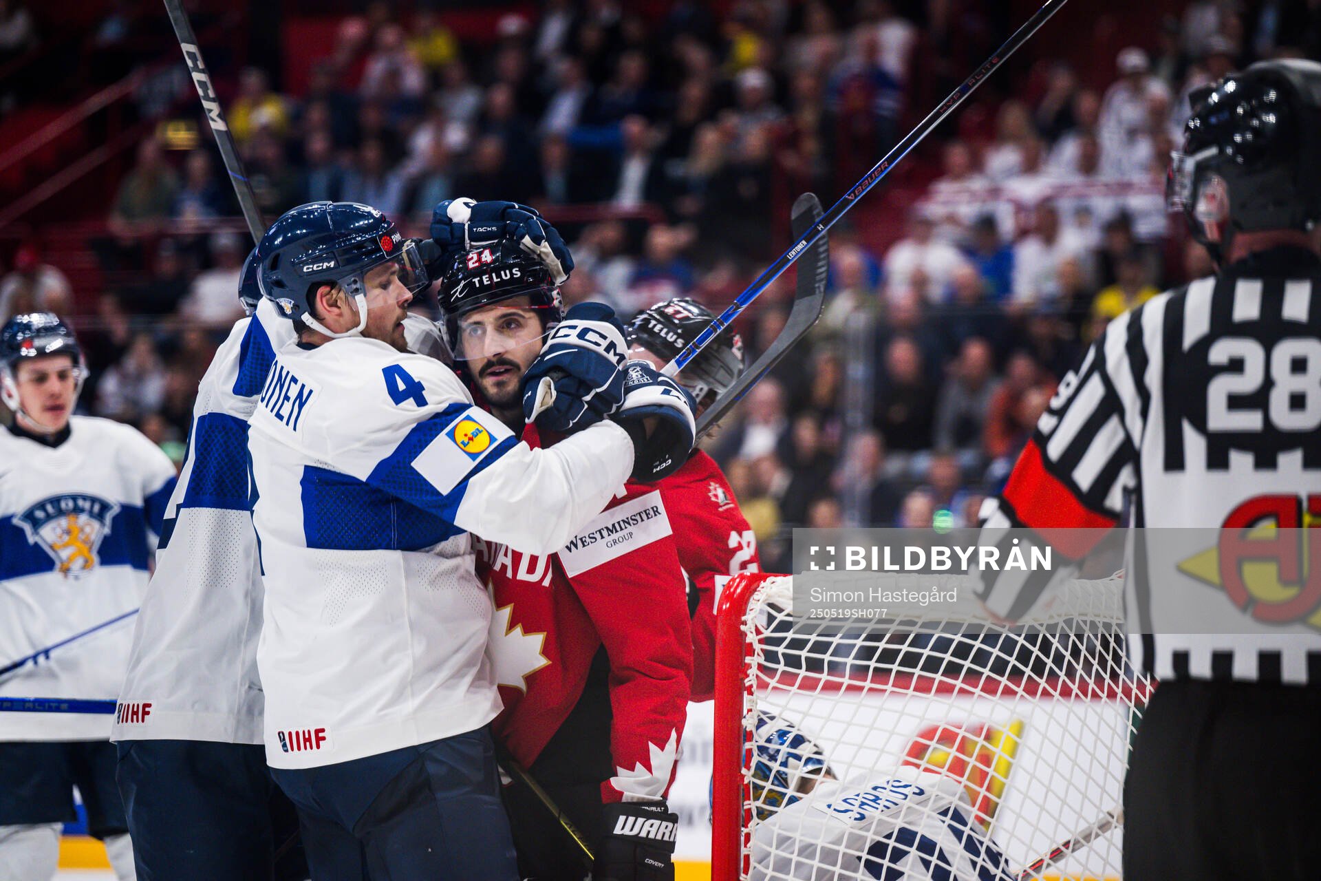 Mikko Lehtonen of Finland and Phillip Danault of Canada