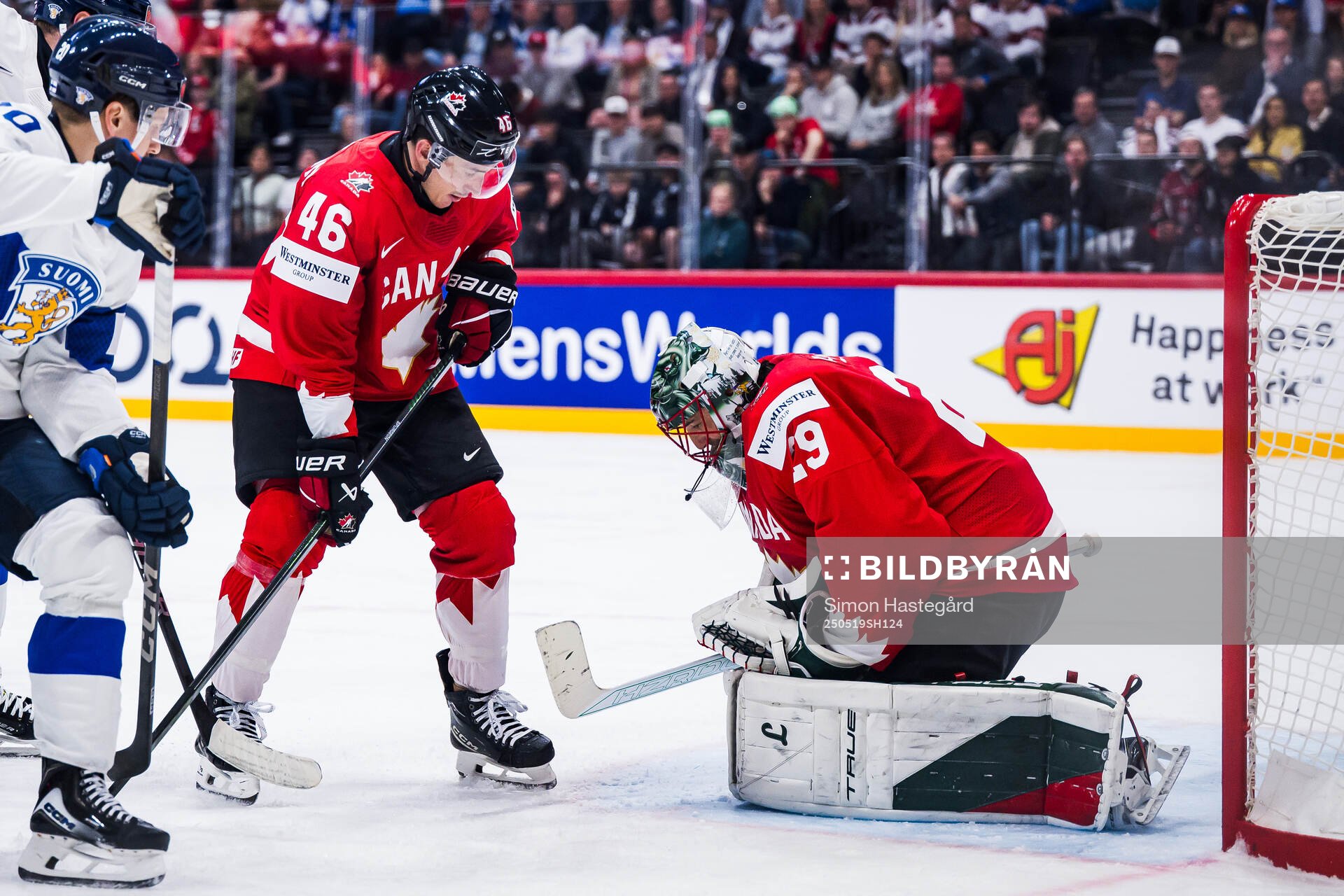Jared Spurgeon and goaltender Marc-André Fleury of Canada