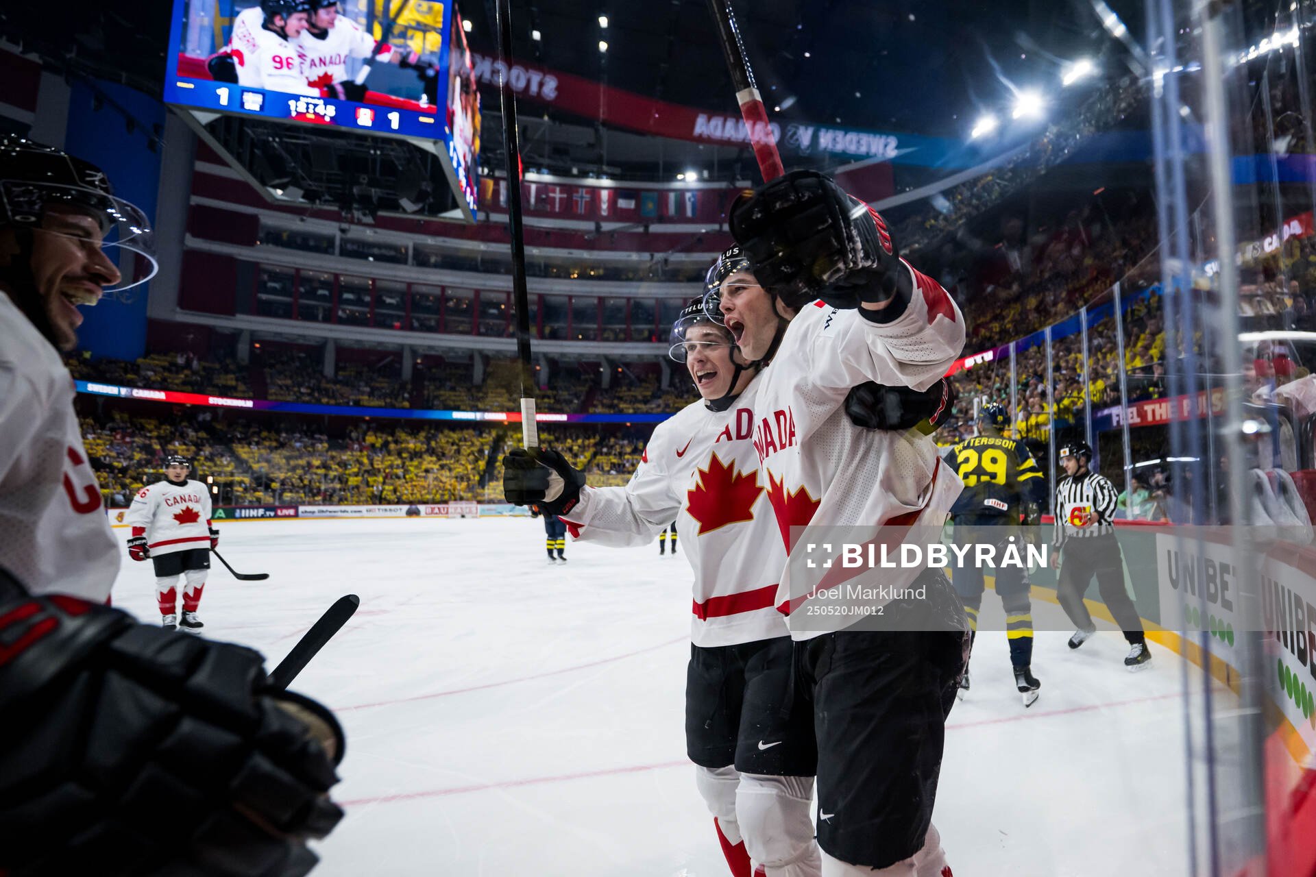 Noah Dobson, Macklin Celebrini and Tyson Foerster of Canada