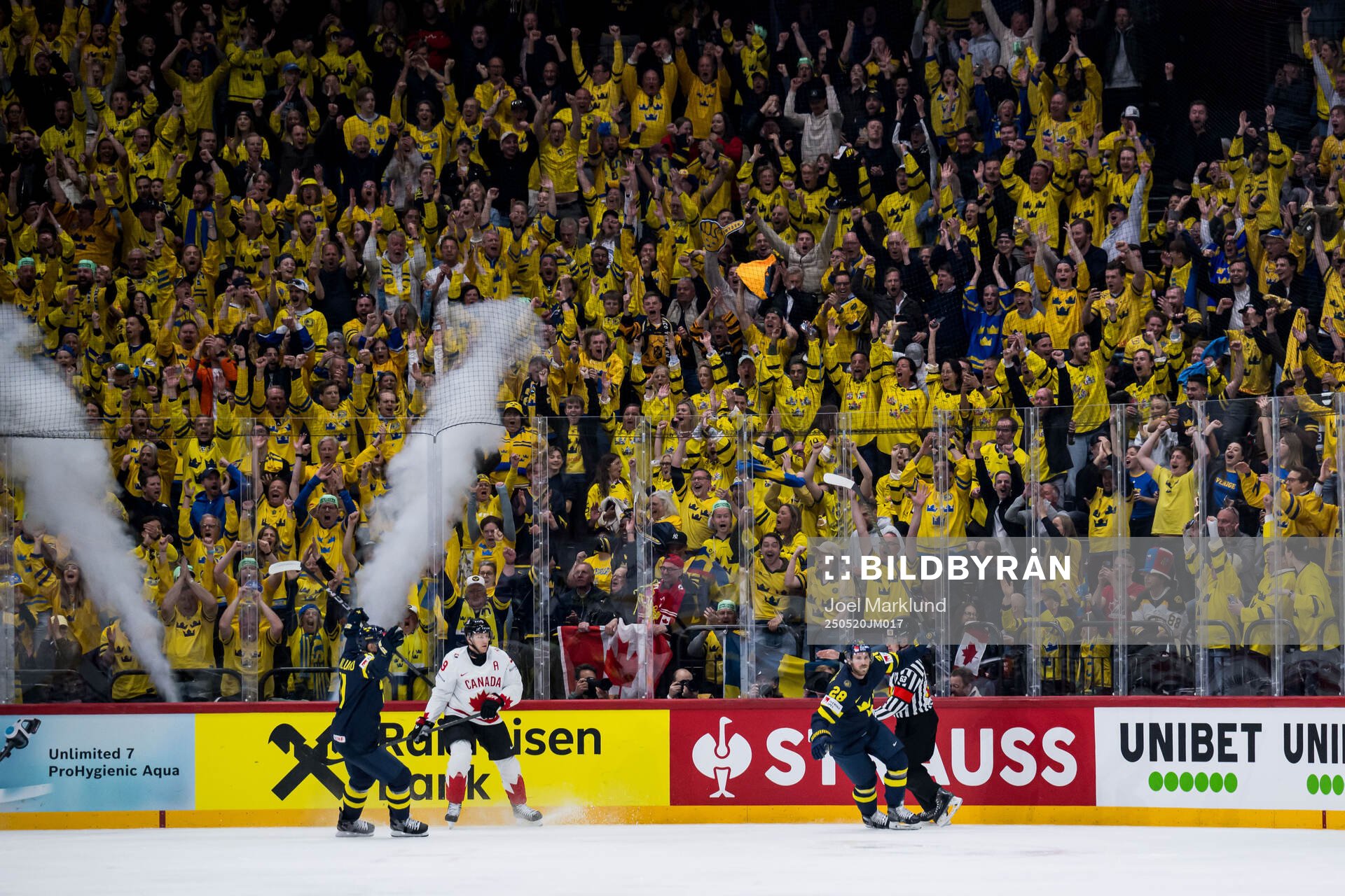 Mikael Backlund and Elias Lindholm of Sweden celebrate