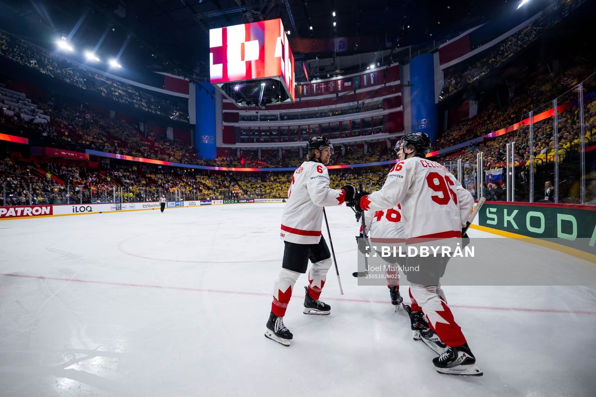 Travis Sanheim and Macklin Celebrini of Canada celebrate