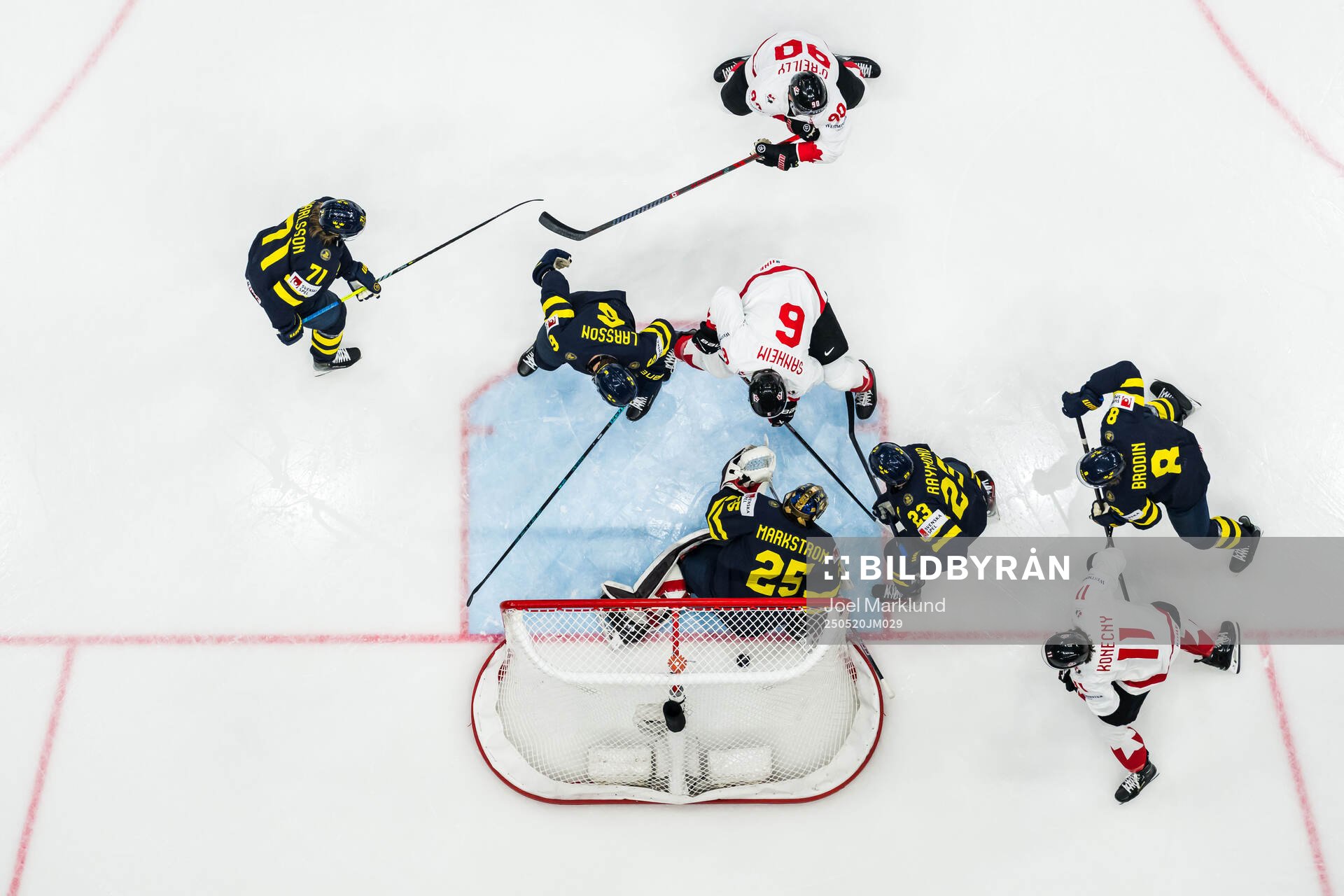 Travis Sanheim of Canada scores 0-1 behind goaltender Jacob