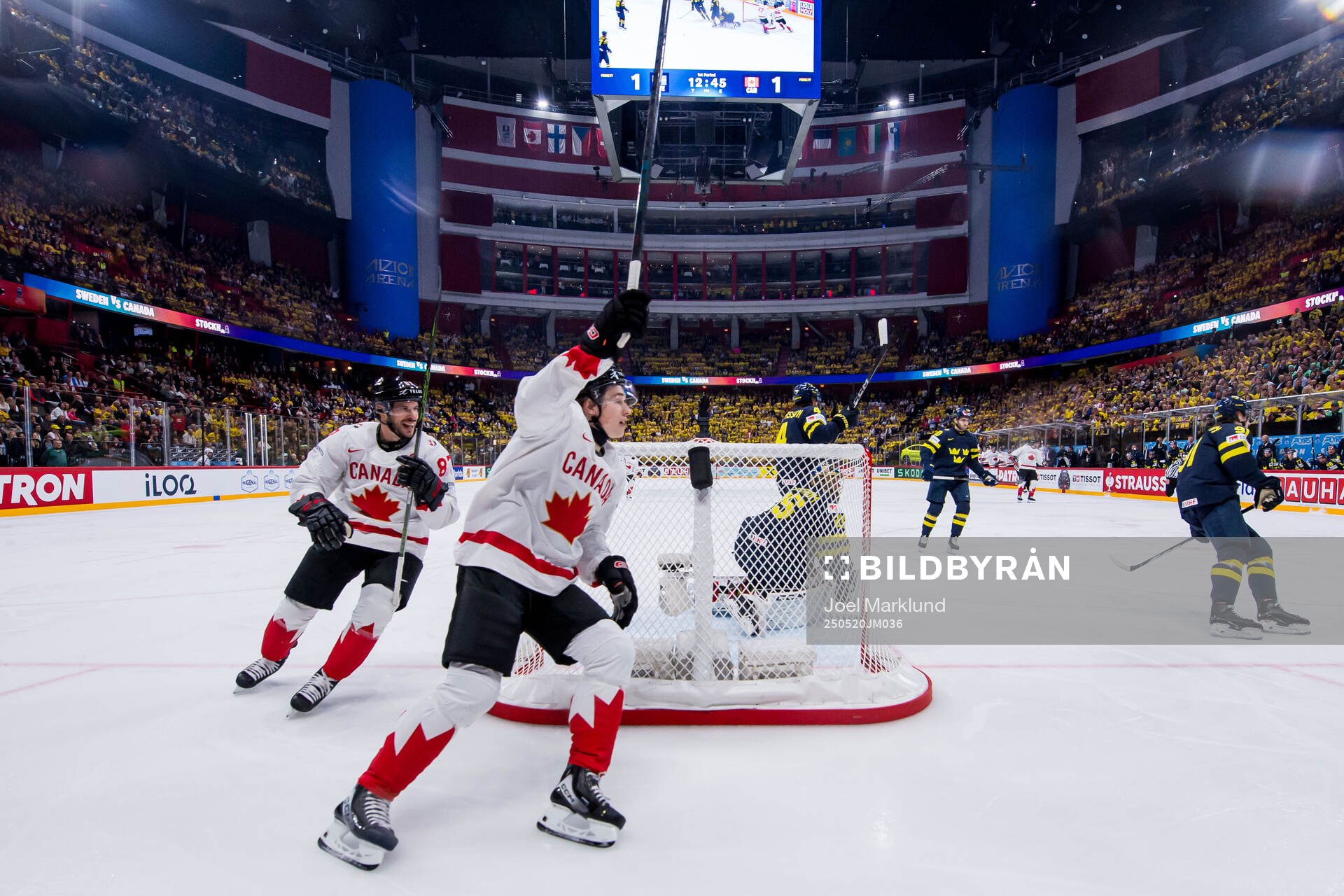 Sidney Crosby and Macklin Celebrini of Canada celebrate