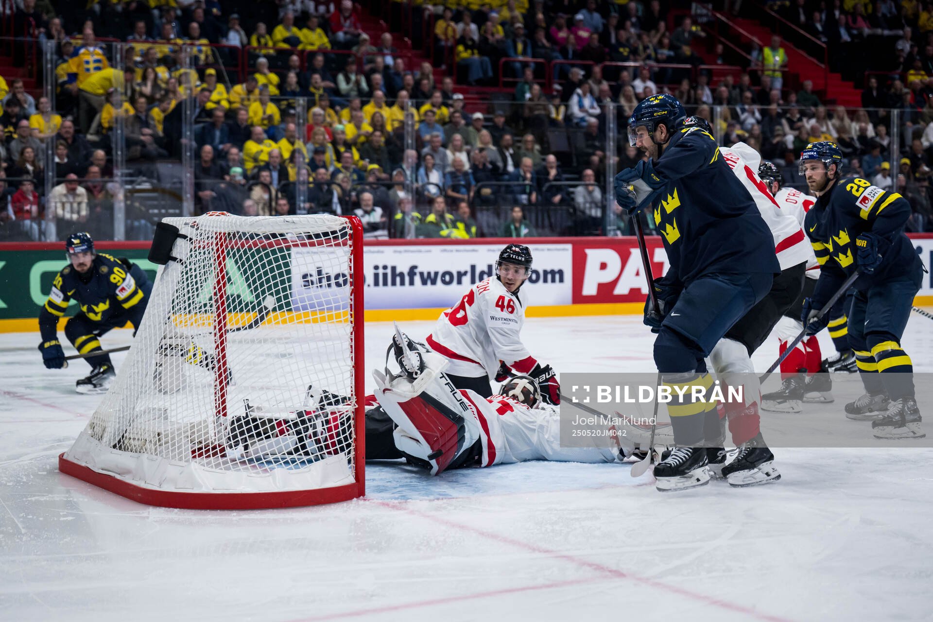 Marcus Johansson of Sweden scores 2-3 behind goaltender