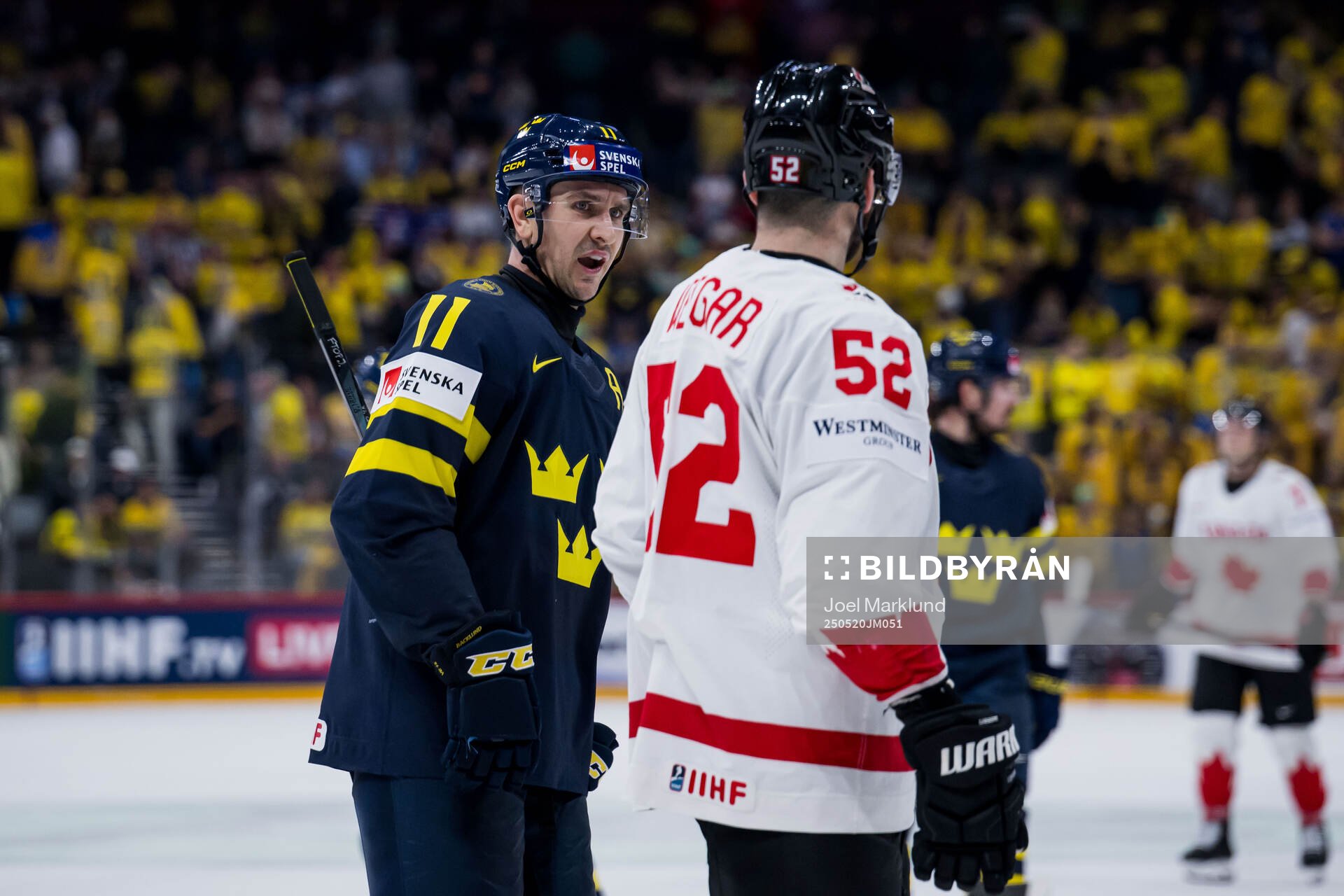 Mikael Backlund of Sweden and MacKenzie Weegar of Canada
