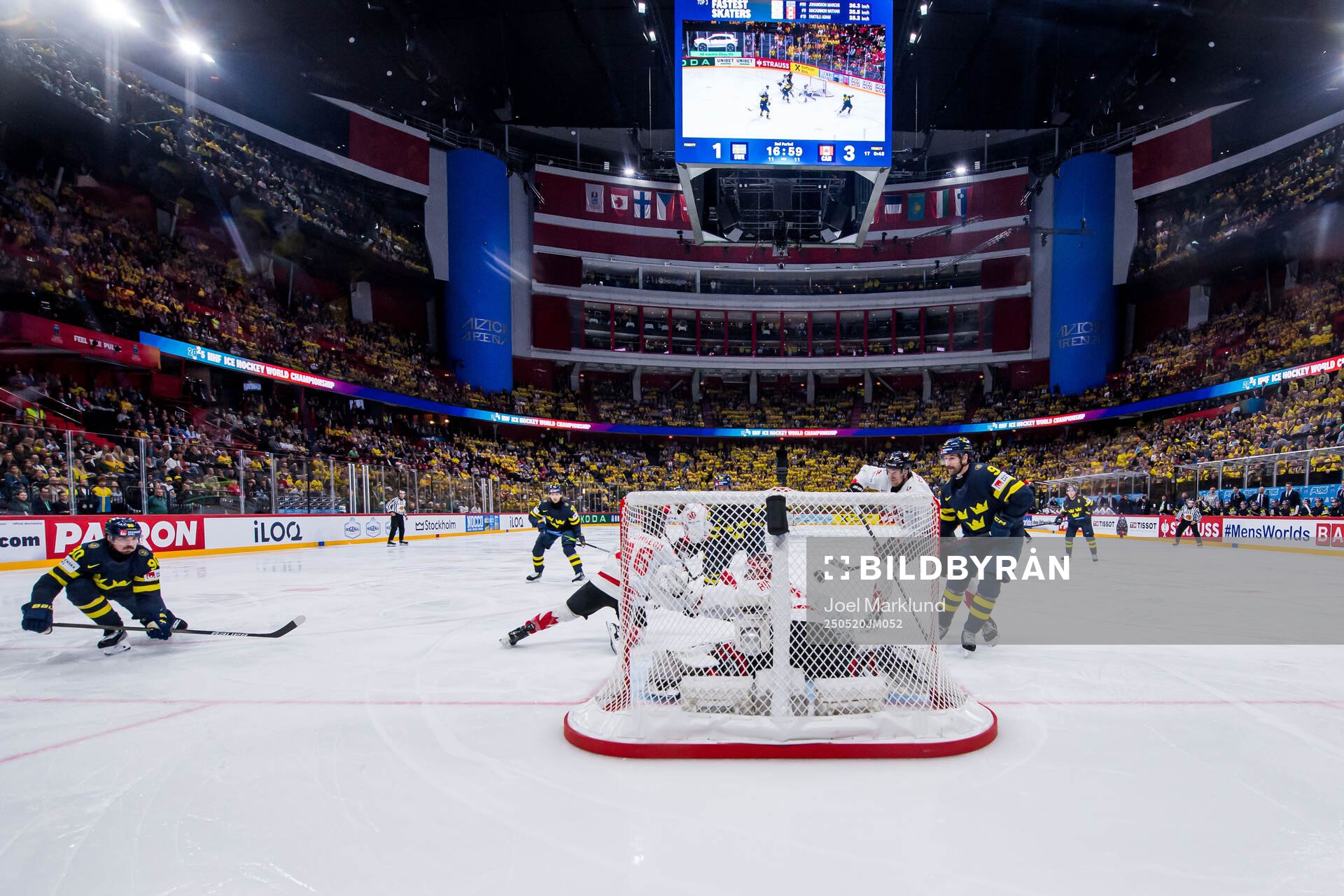 Marcus Johansson of Sweden scores 2-3 behind goaltender