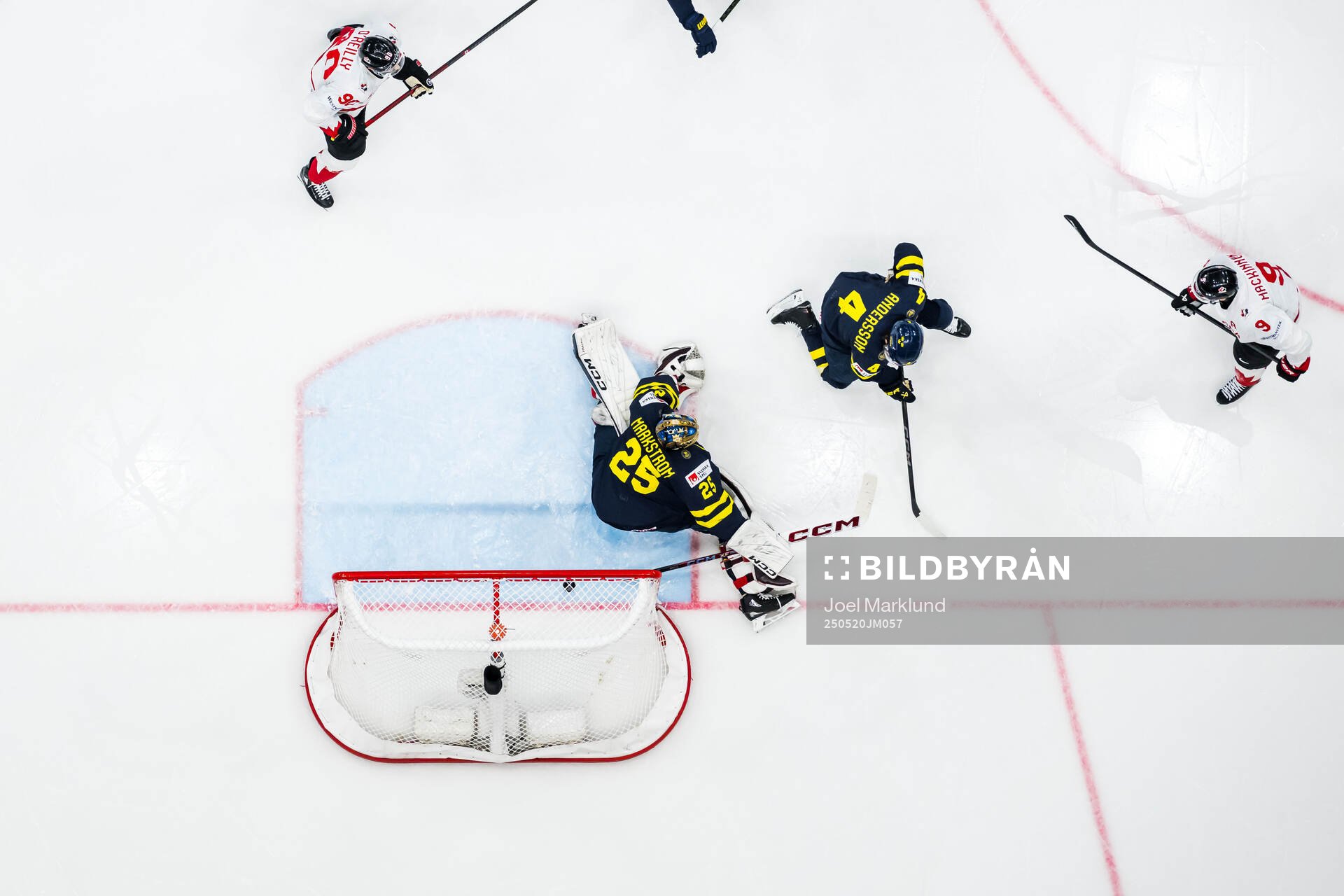 Nathan MacKinnon of Canada scores 2-5 behind goaltender