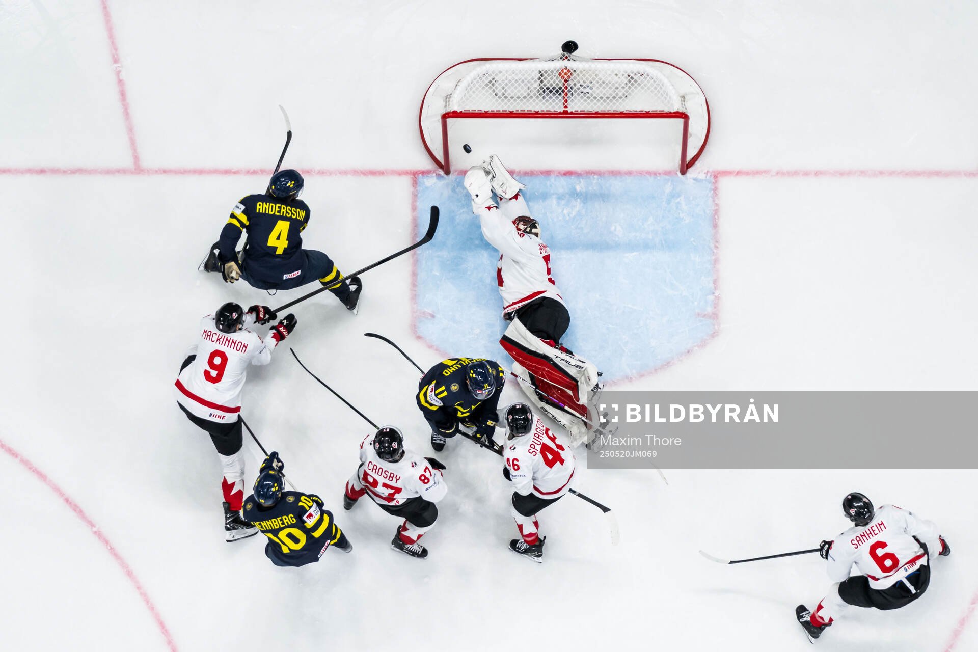 Rasmus Andersson of Sweden scores 3-5 behind goaltender