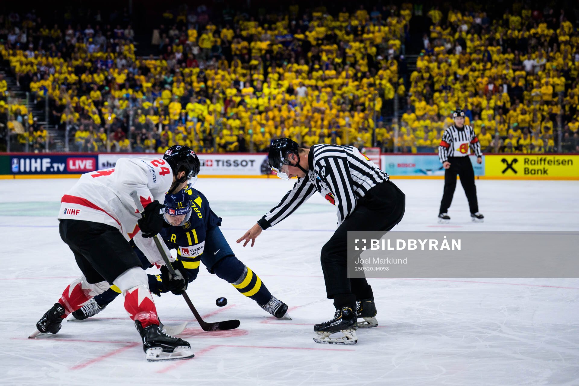 Phillip Danault of Canada and Mikael Backlund of Sweden