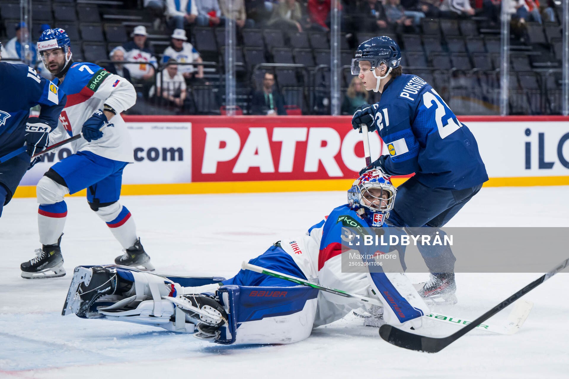 Patrik Puistola of Finland scores 0-1 behind goaltender