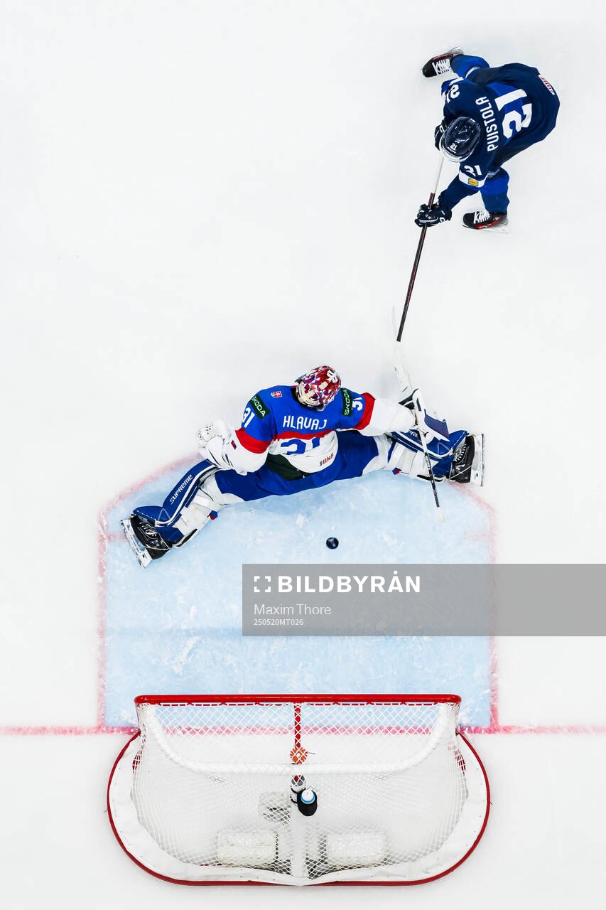 Patrik Puistola of Finland scores the 0-1 goal behind