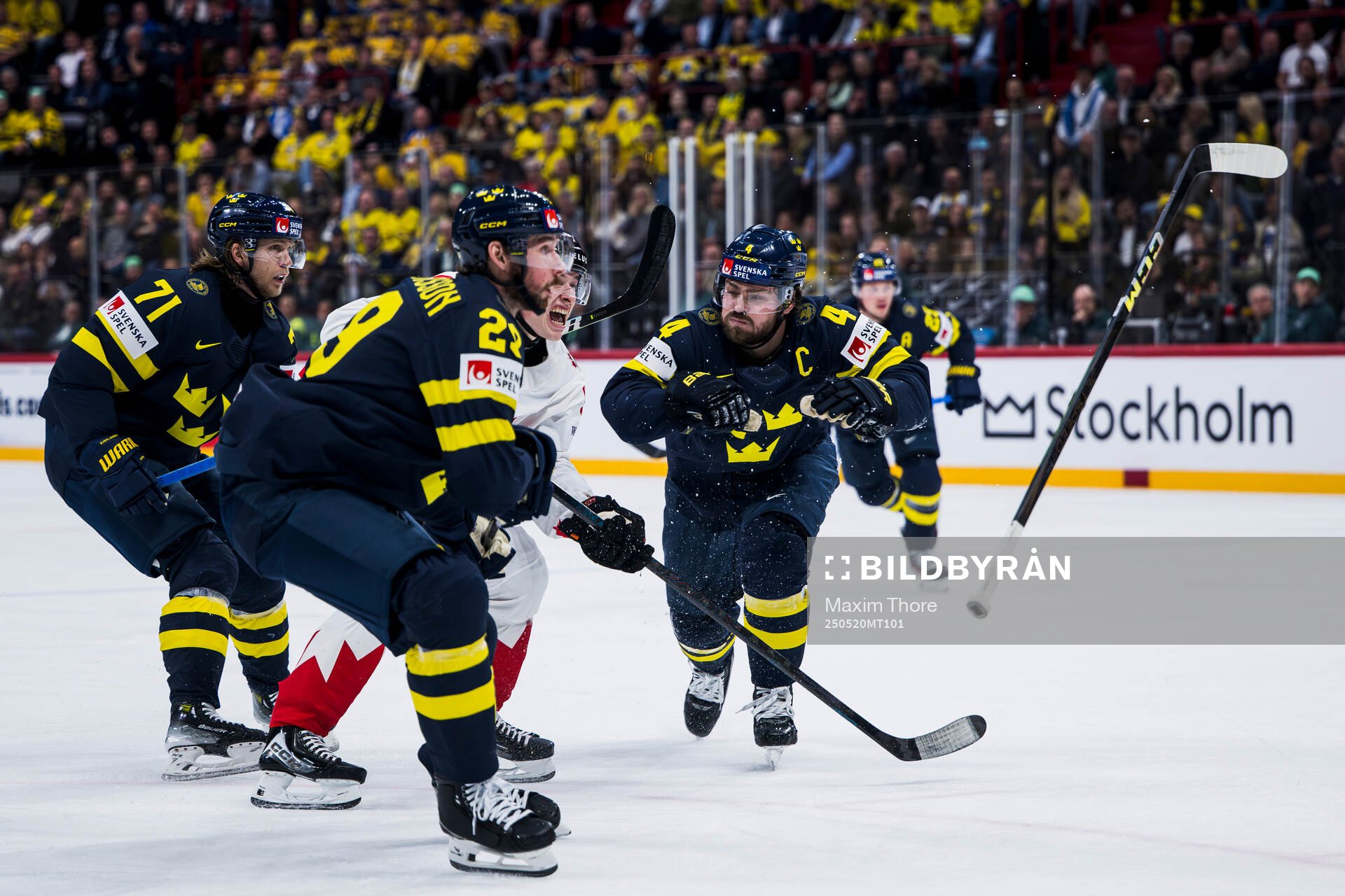 Travis Sanheim of Canada against Marcus Pettersson and