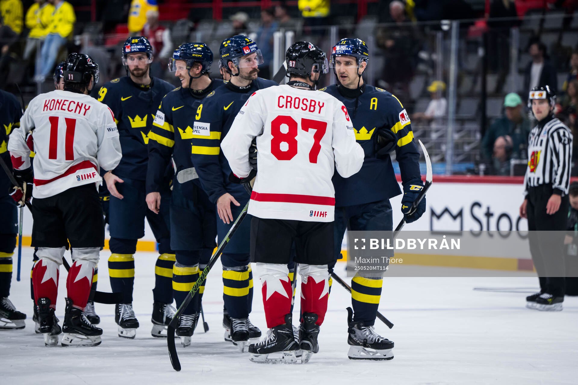 Sidney Crosby of Canada and Mikael Backlund of Sweden