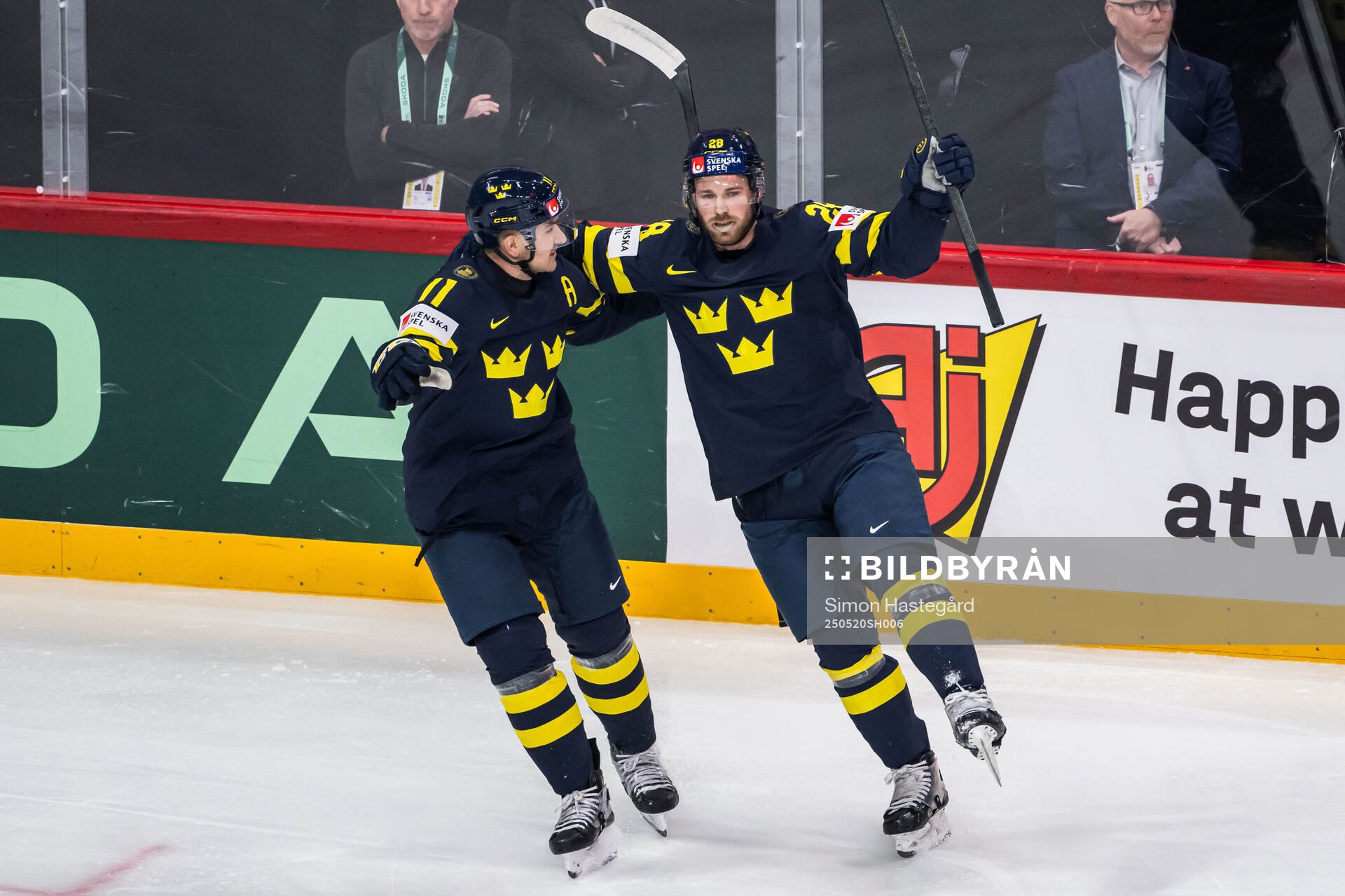 Mikael Backlund and Elias Lindholm of Sweden celebrate
