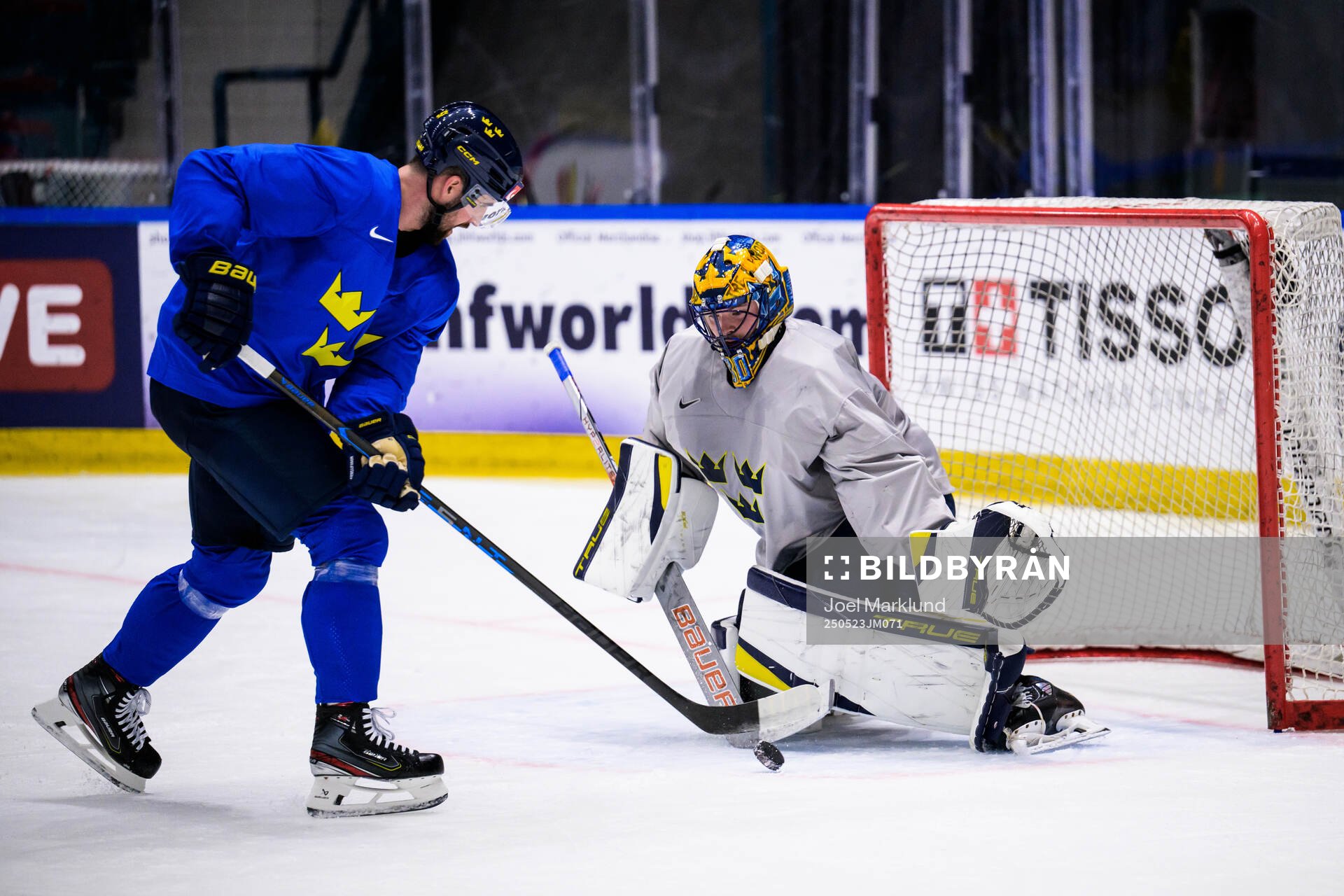 Erik Gustafsson and goaltender Samuel Ersson of Sweden at a