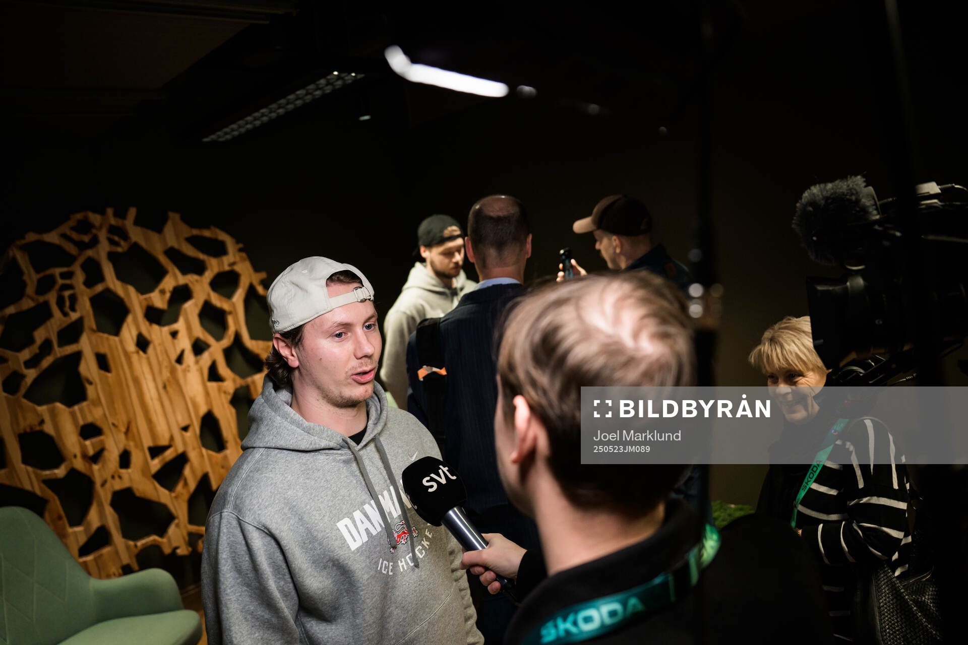 Nick Olesen and goaltender Frederik Dichow of Denmark being