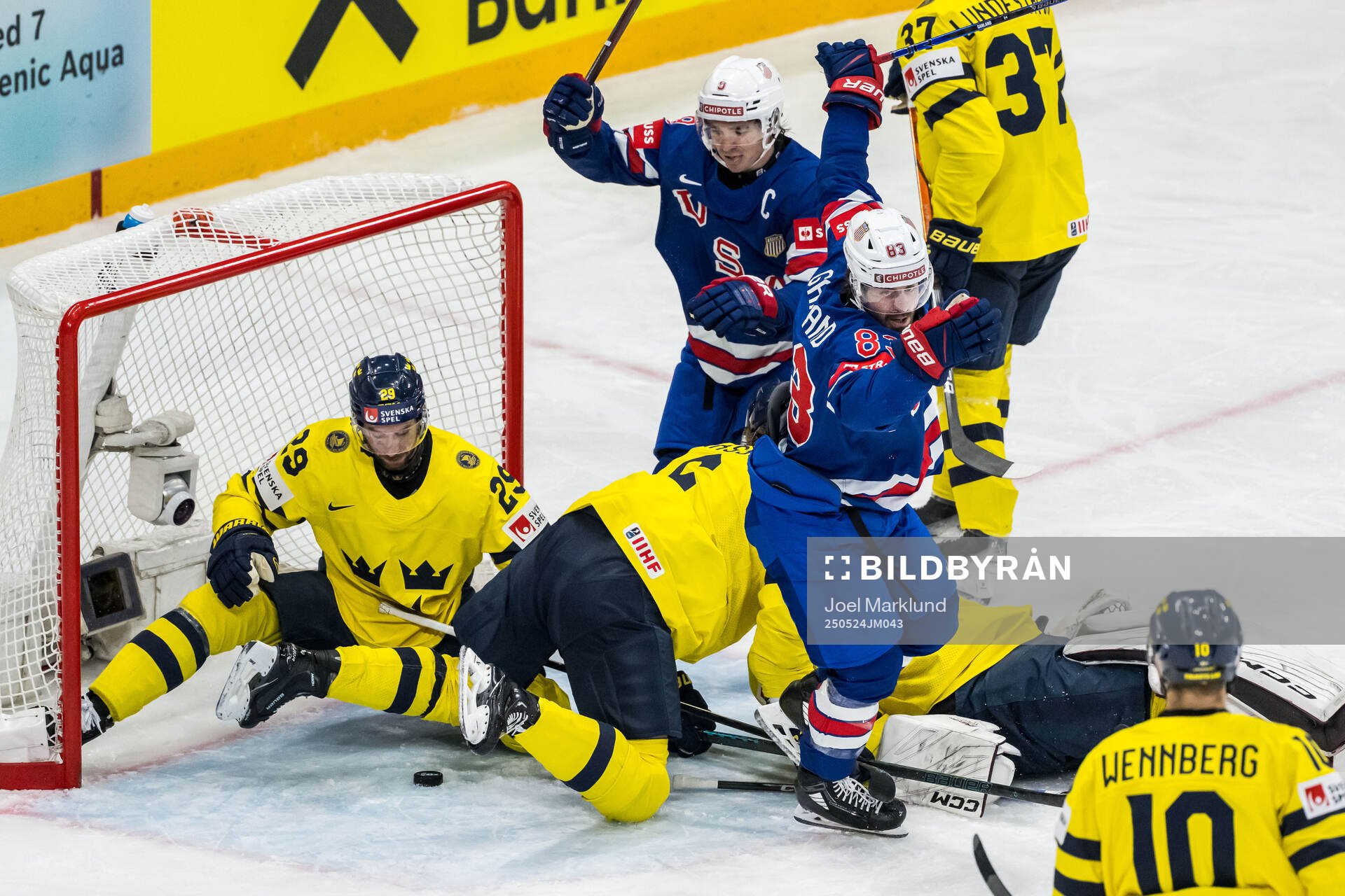 Clayton Keller and Conor Garland of USA celebrate