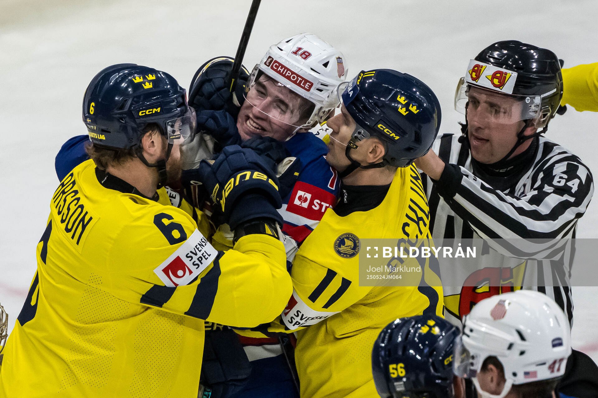 Adam Larsson and Mikael Backlund of Sweden against Drew