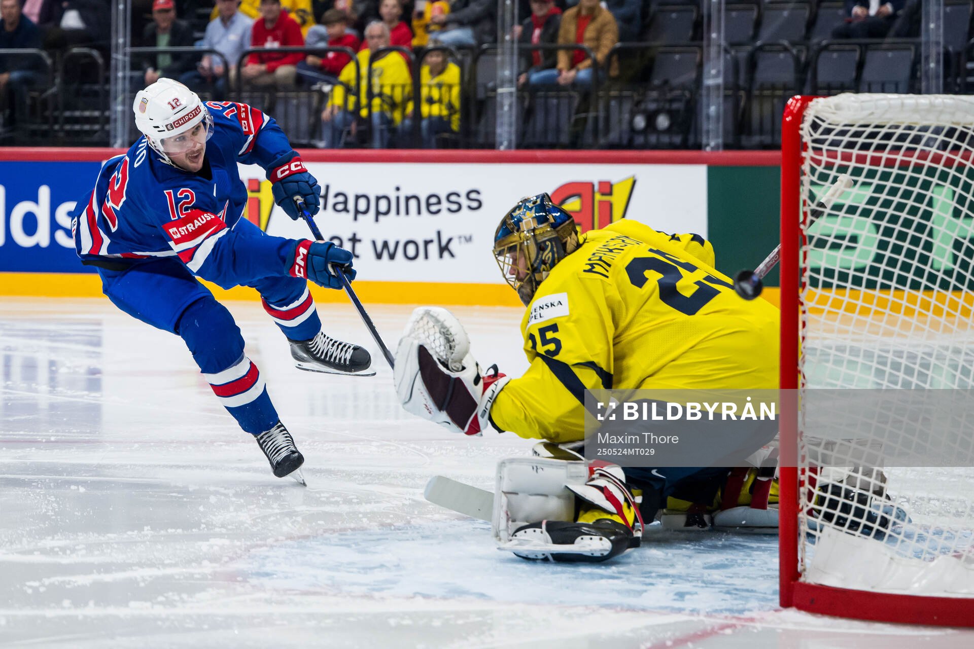 Shane Pinto of USA and goaltender Jacob Markström of Sweden