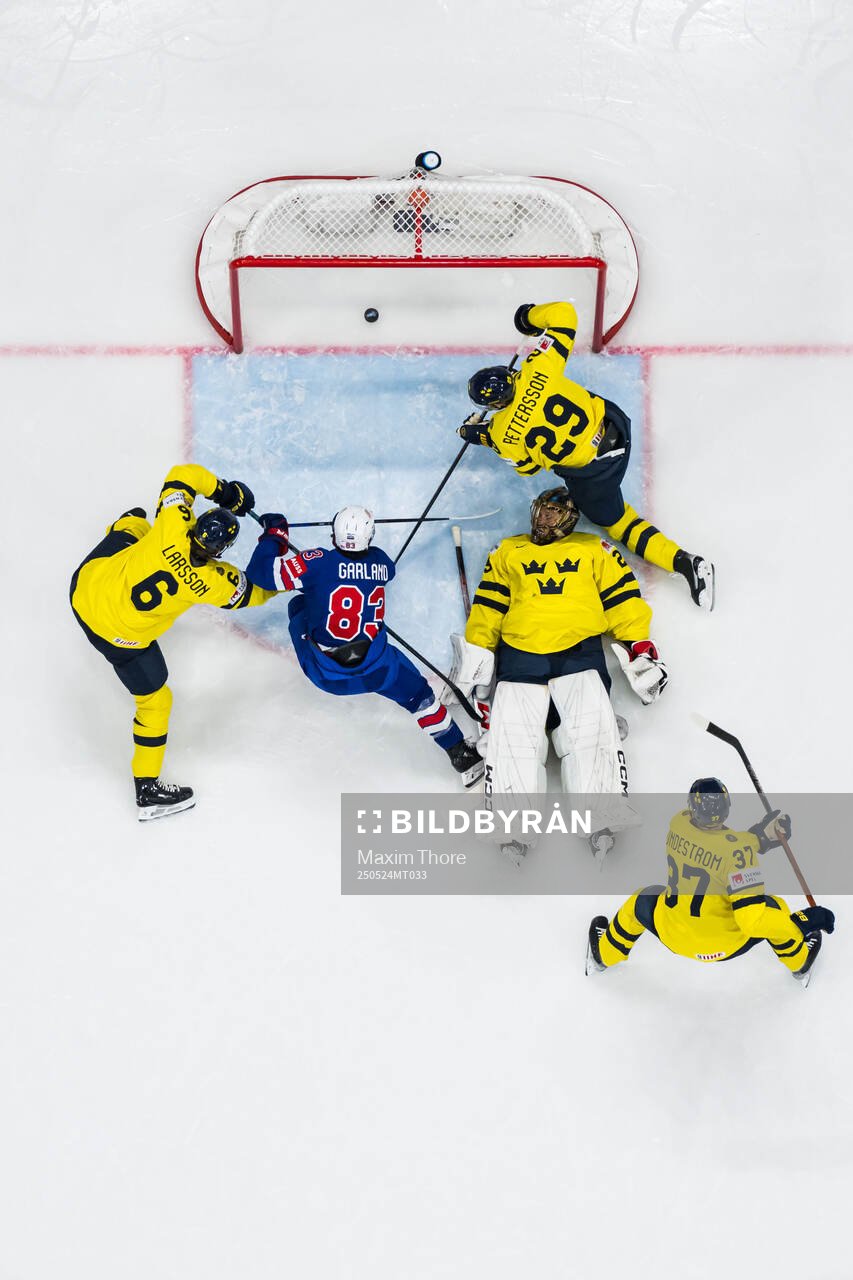 Conor Garland of USA scores 0-3 behind goaltender Jacob
