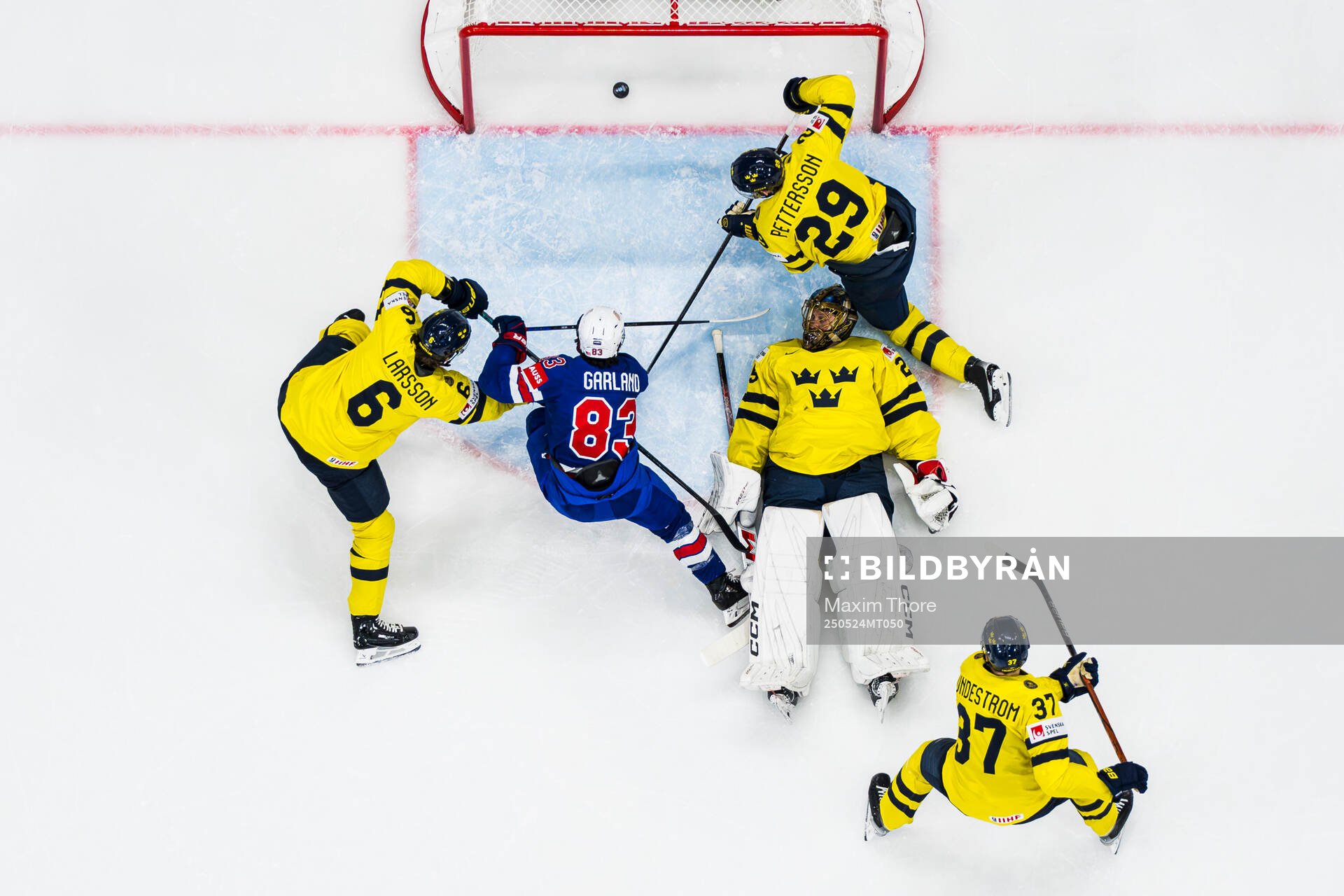 Conor Garland of USA scores the 0-3 goal behind goaltender