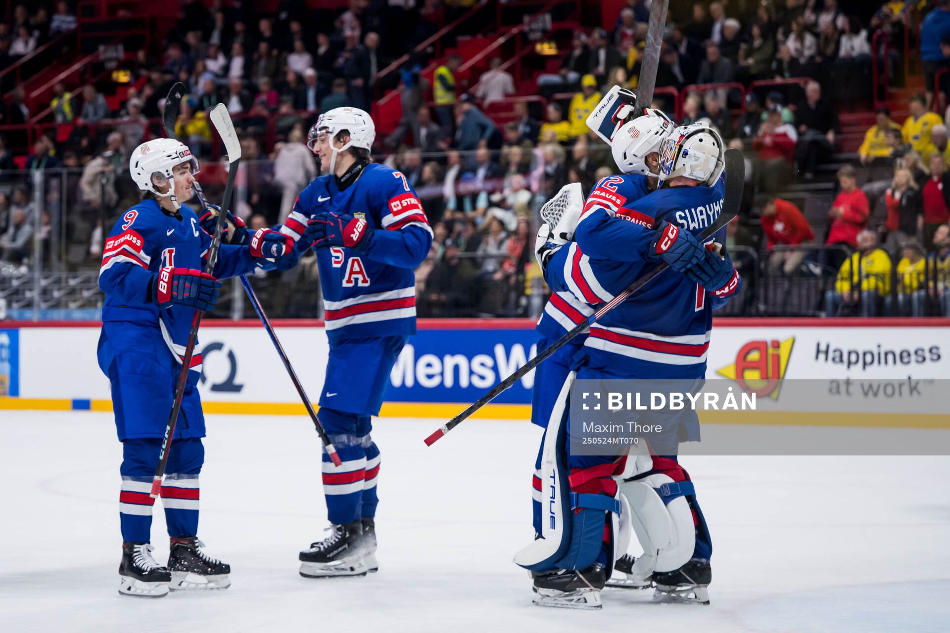 Goaltender Jeremy Swayman of USA celebrates with team mates