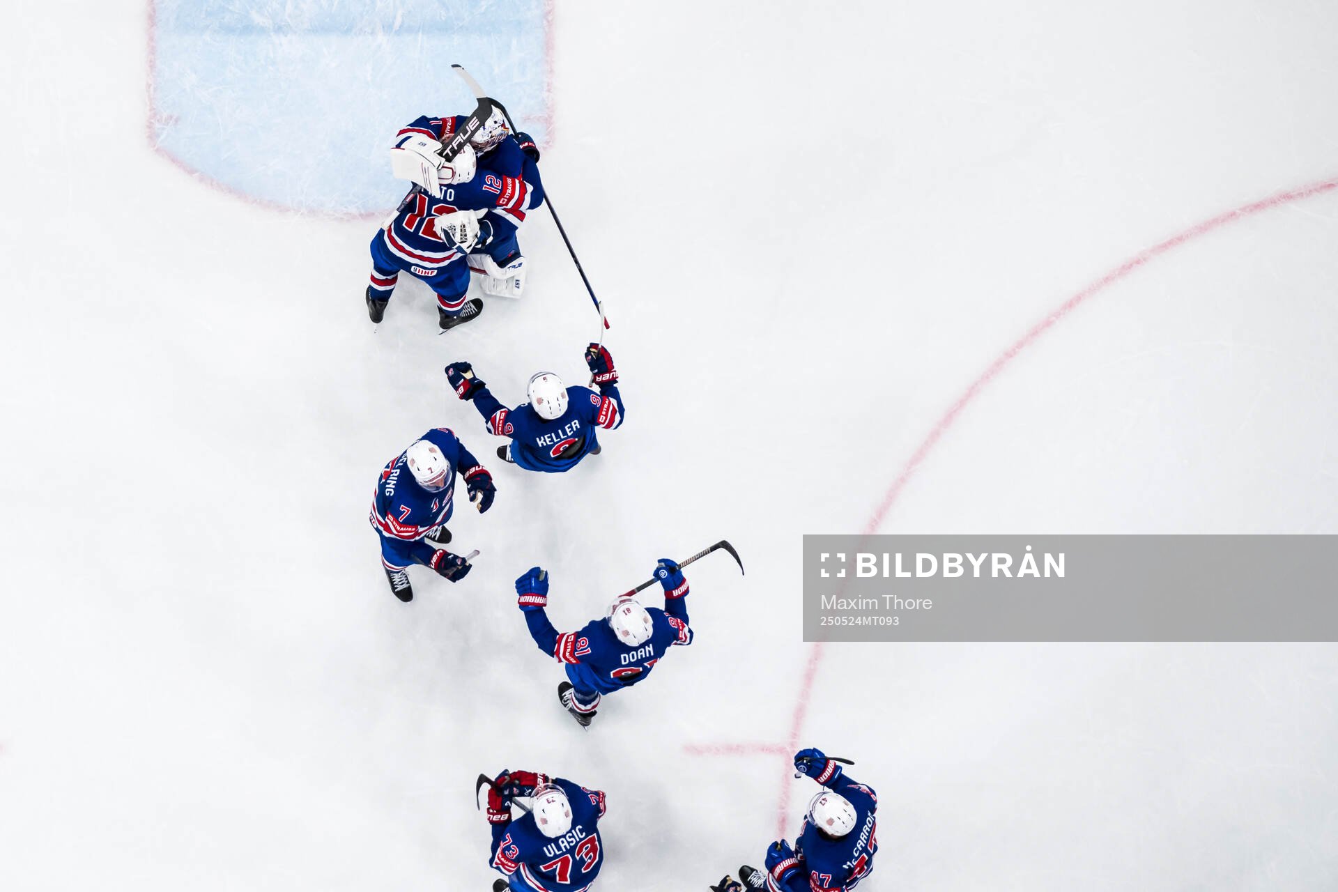 Goaltender Jeremy Swayman of USA celebrate with teammates