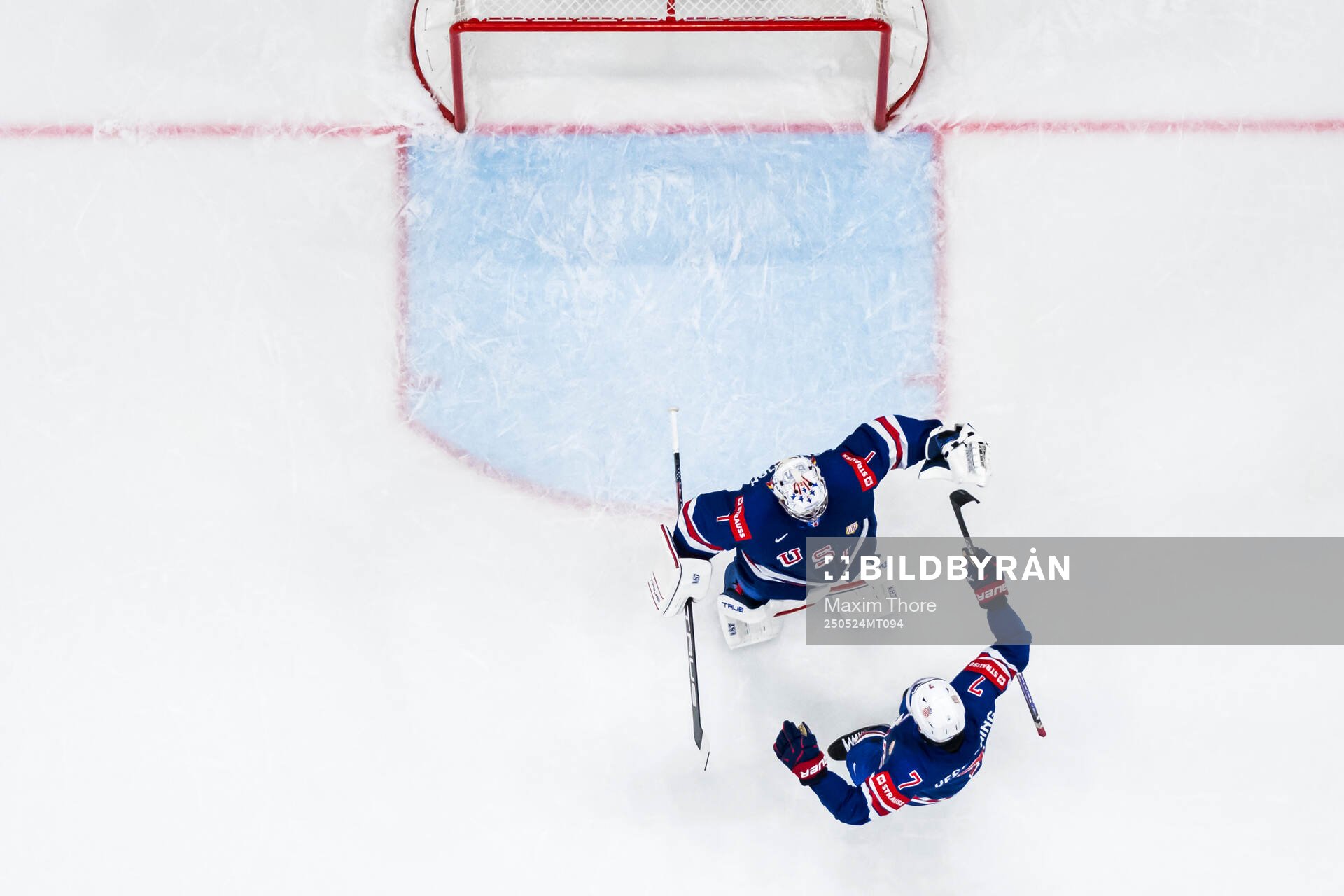 Goaltender Jeremy Swayman and Michael Kesselring of USA