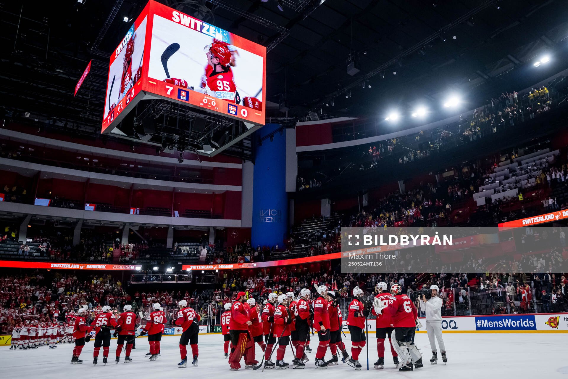 Leonardo Genoni of Switzerland celebrates with teammates
