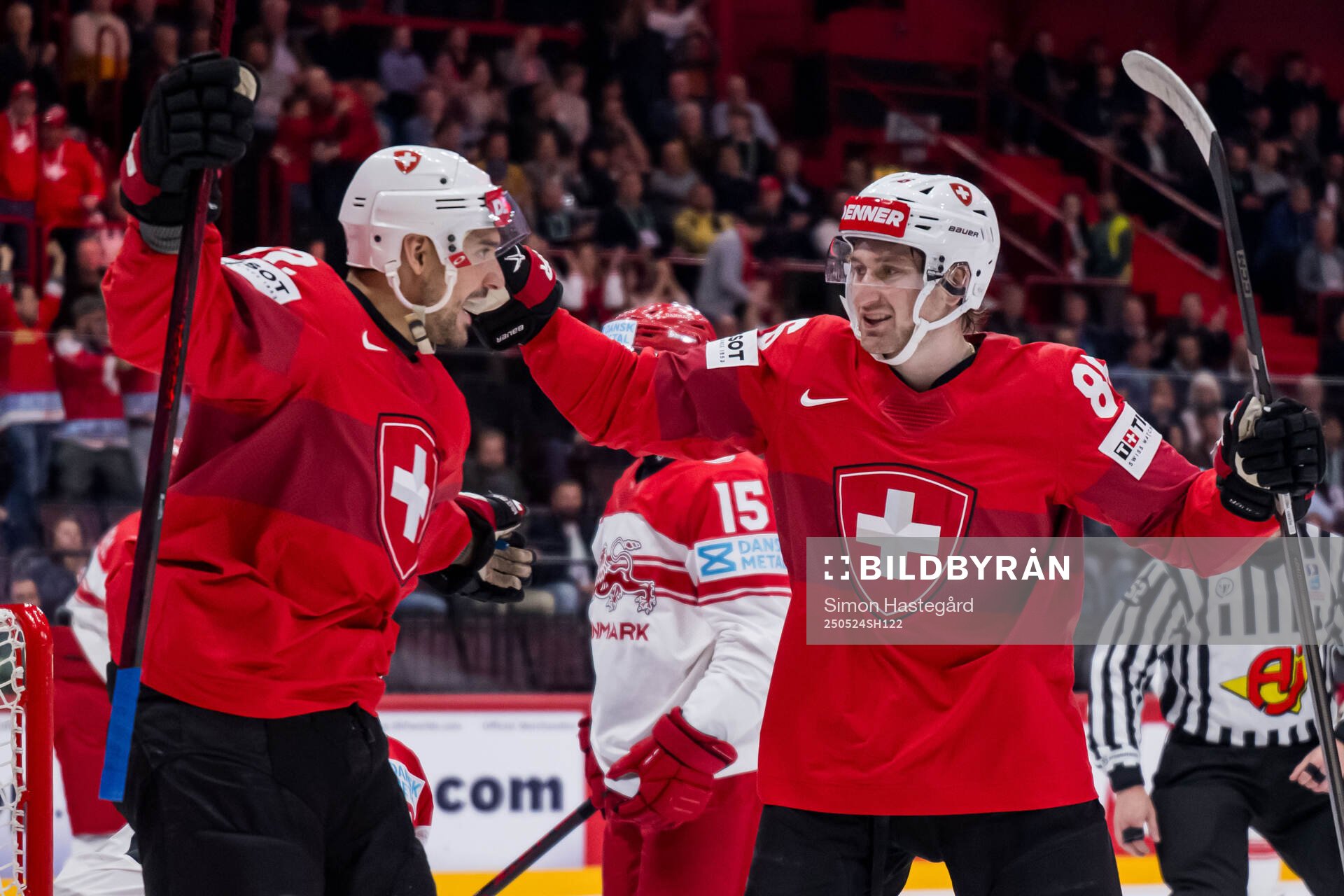 Nino Niederreiter and Janis Moser of Switzerland celebrate