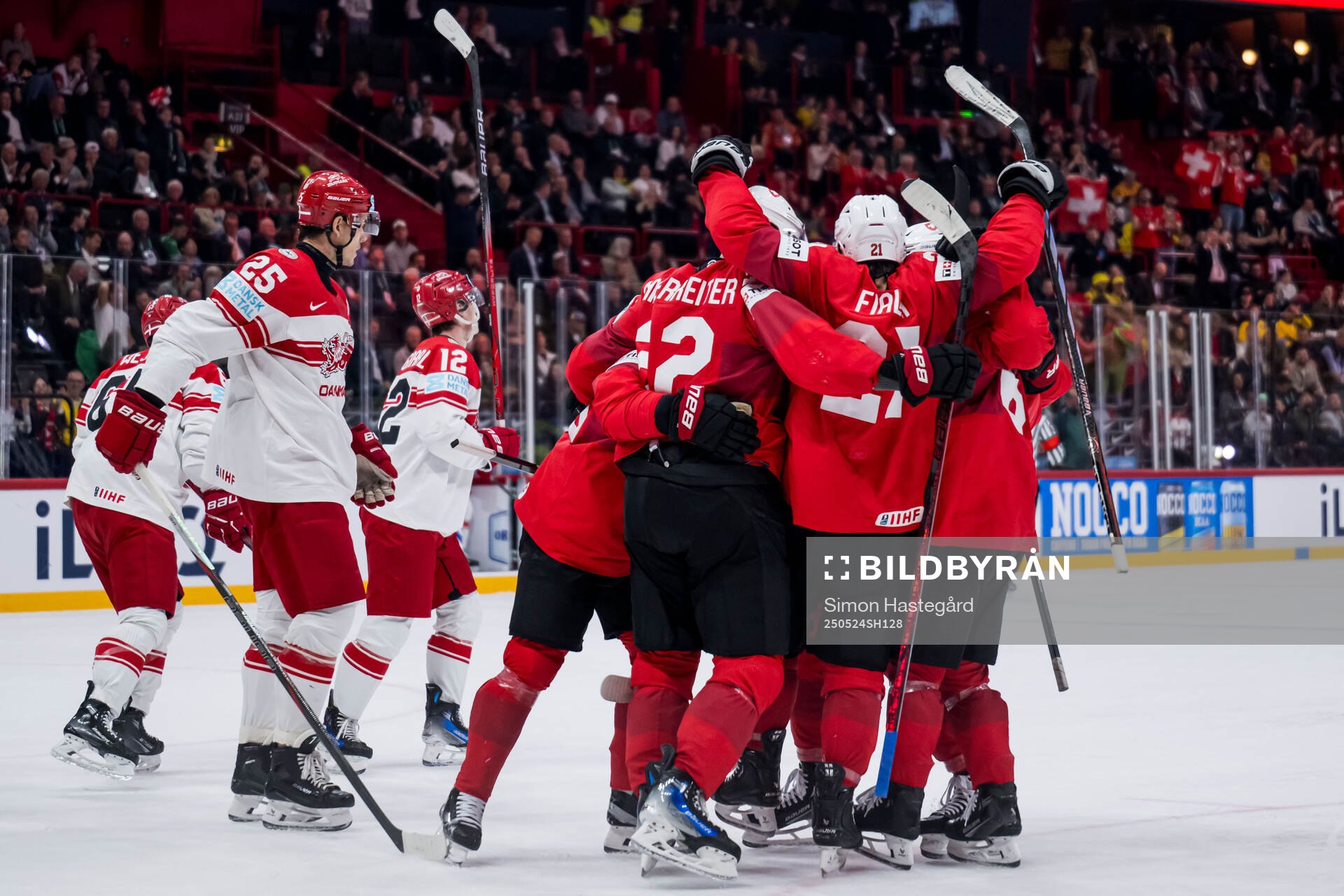 Nino Niederreiter of Switzerland celebrates with team mates