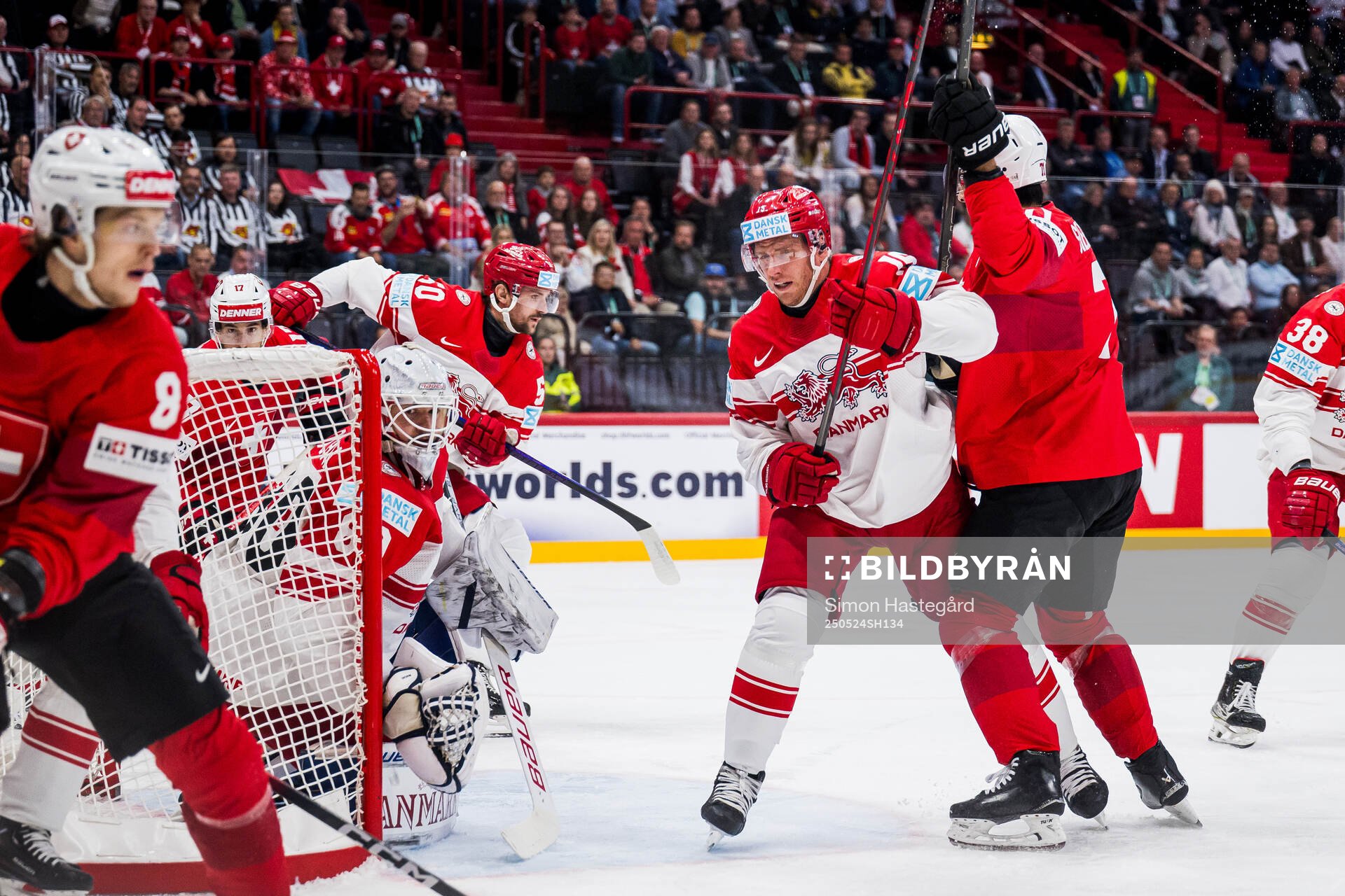 Goaltender Frederik Dichow and Matias Lassen of Denmark