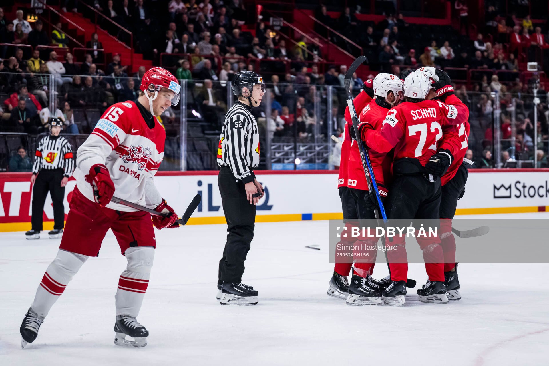 Tyler Moy of Switzerland celebarates with team mates and