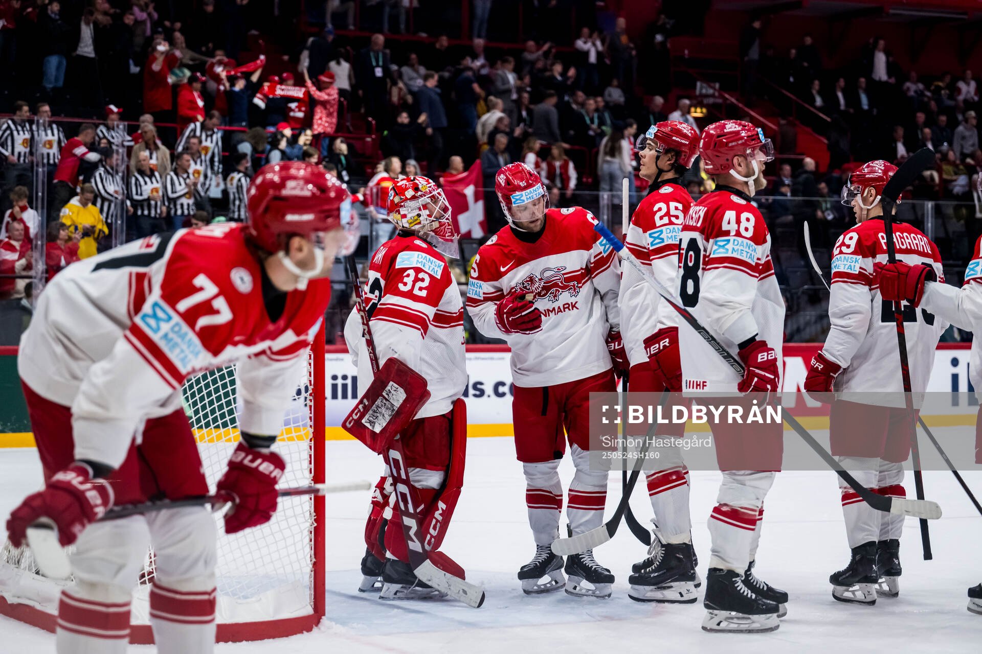 Goaltender Sebastian Dahm of Denmark looks dejected