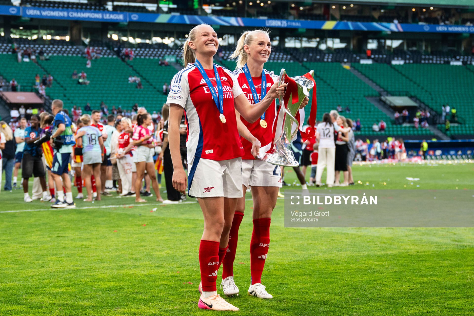 Frida Maanum and Stina Blackstenius of Arsenal celebrate with the trophy after the UEFA Women's Champions League final match between Arsenal and Barcelona on May 24, 2025 in Lisbon.