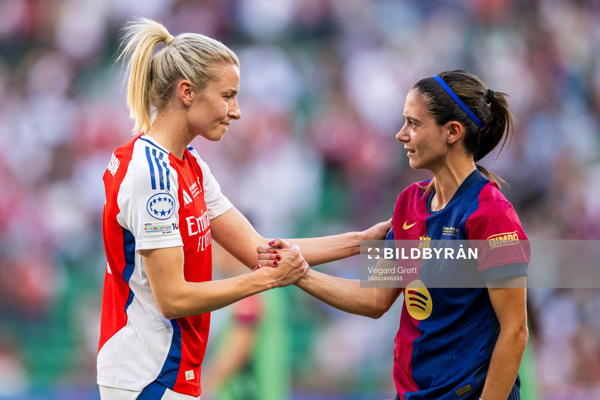Leah Williamson of Arsenal and Aitana Bonmati of Barcelona after the UEFA Women's Champions League final match between Arsenal and Barcelona on May 24, 2025 in Lisbon.