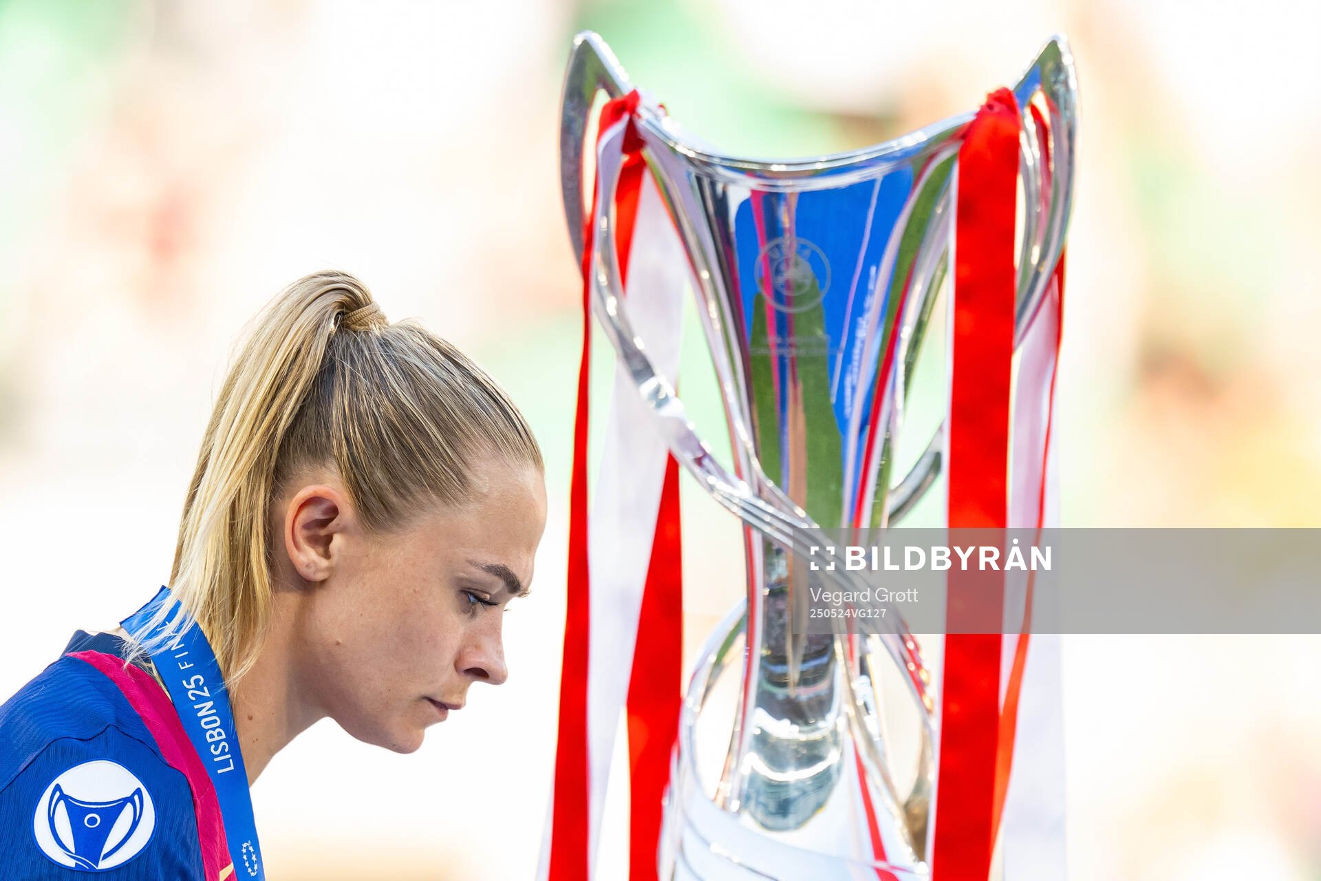 Fridolina Rolfö of Barcelona walks past the trophy