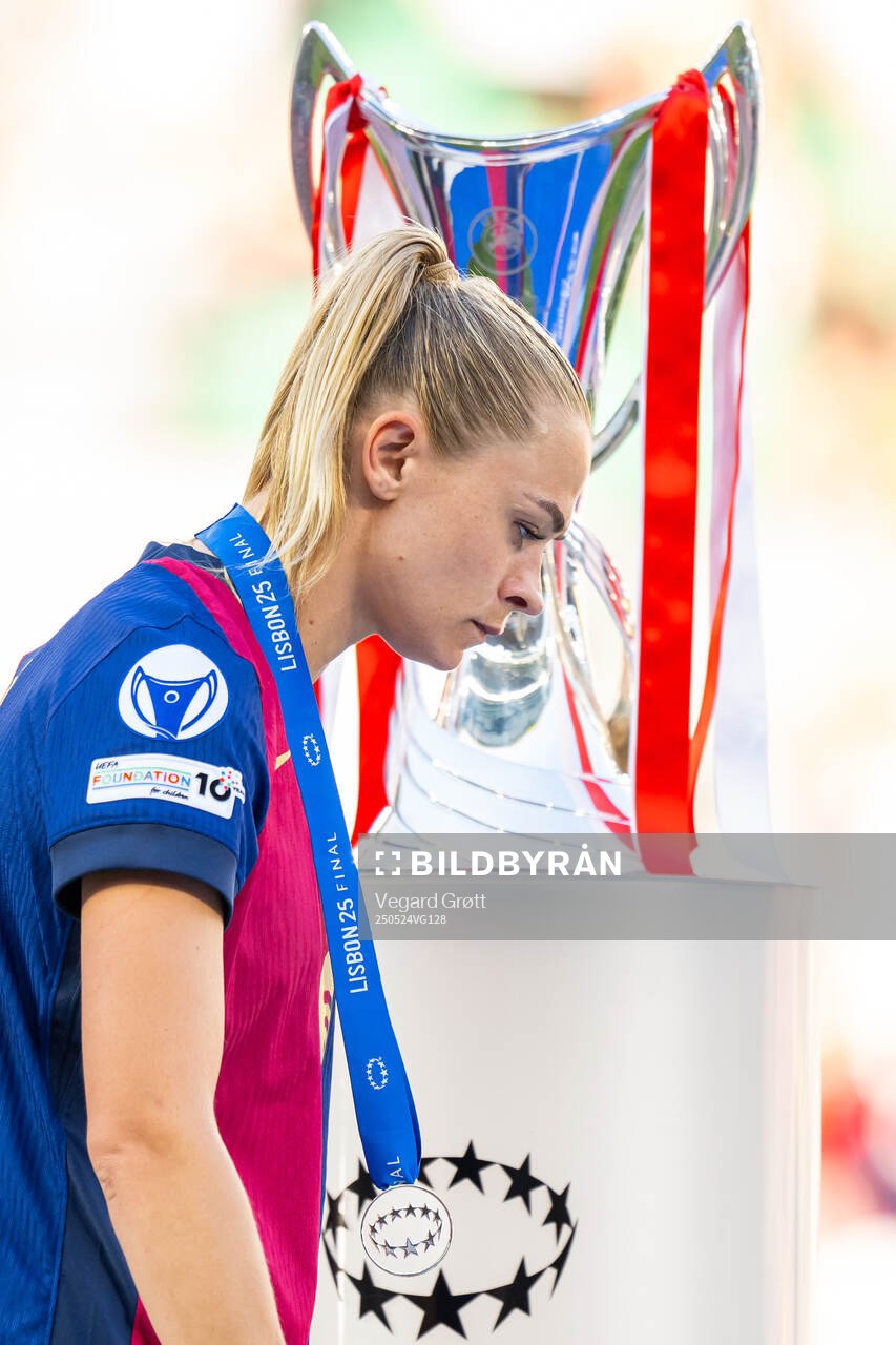 Fridolina Rolfö of Barcelona walks past the trophy