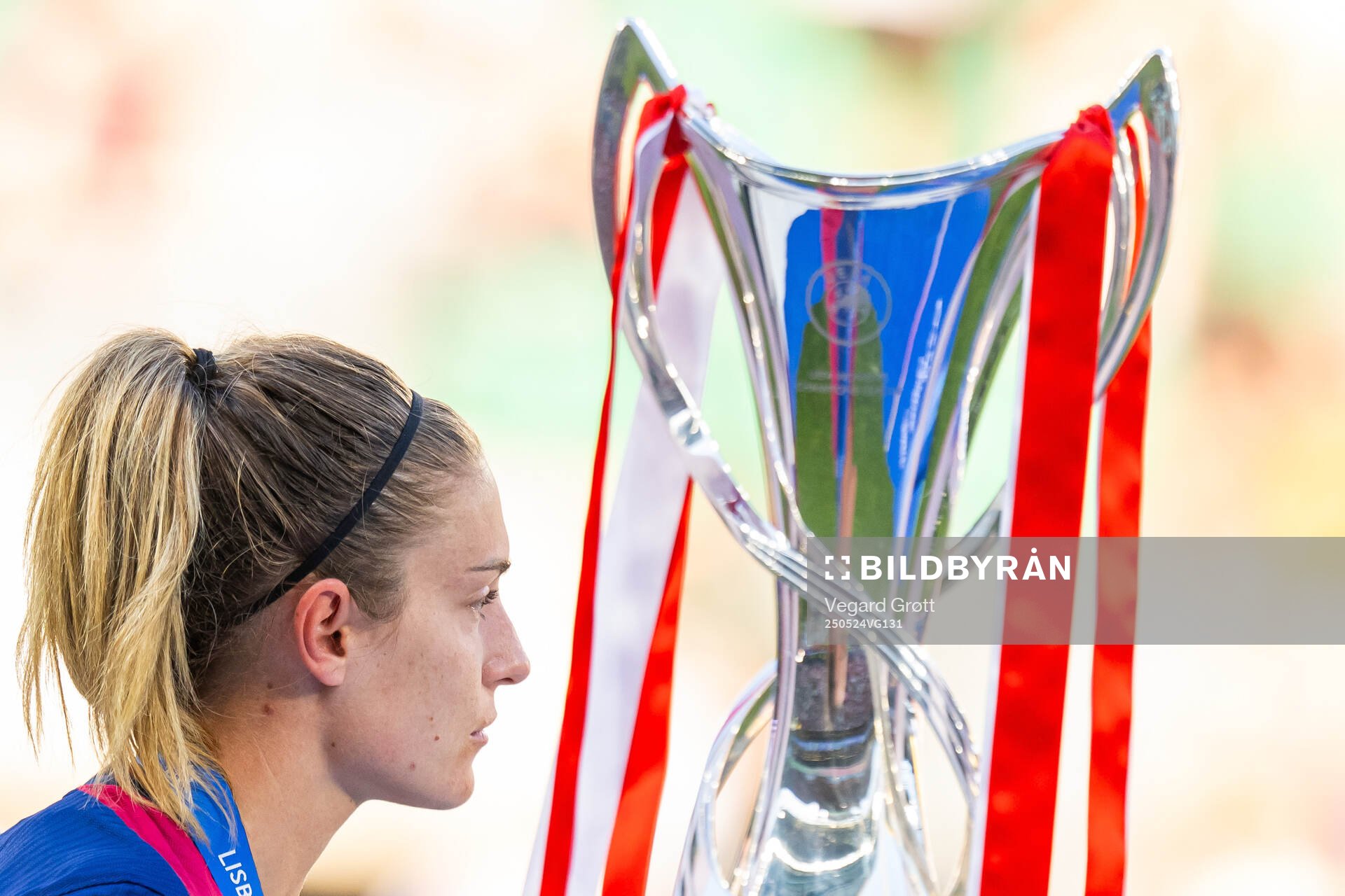 Alexia Putellas of Barcelona walks past the trophy