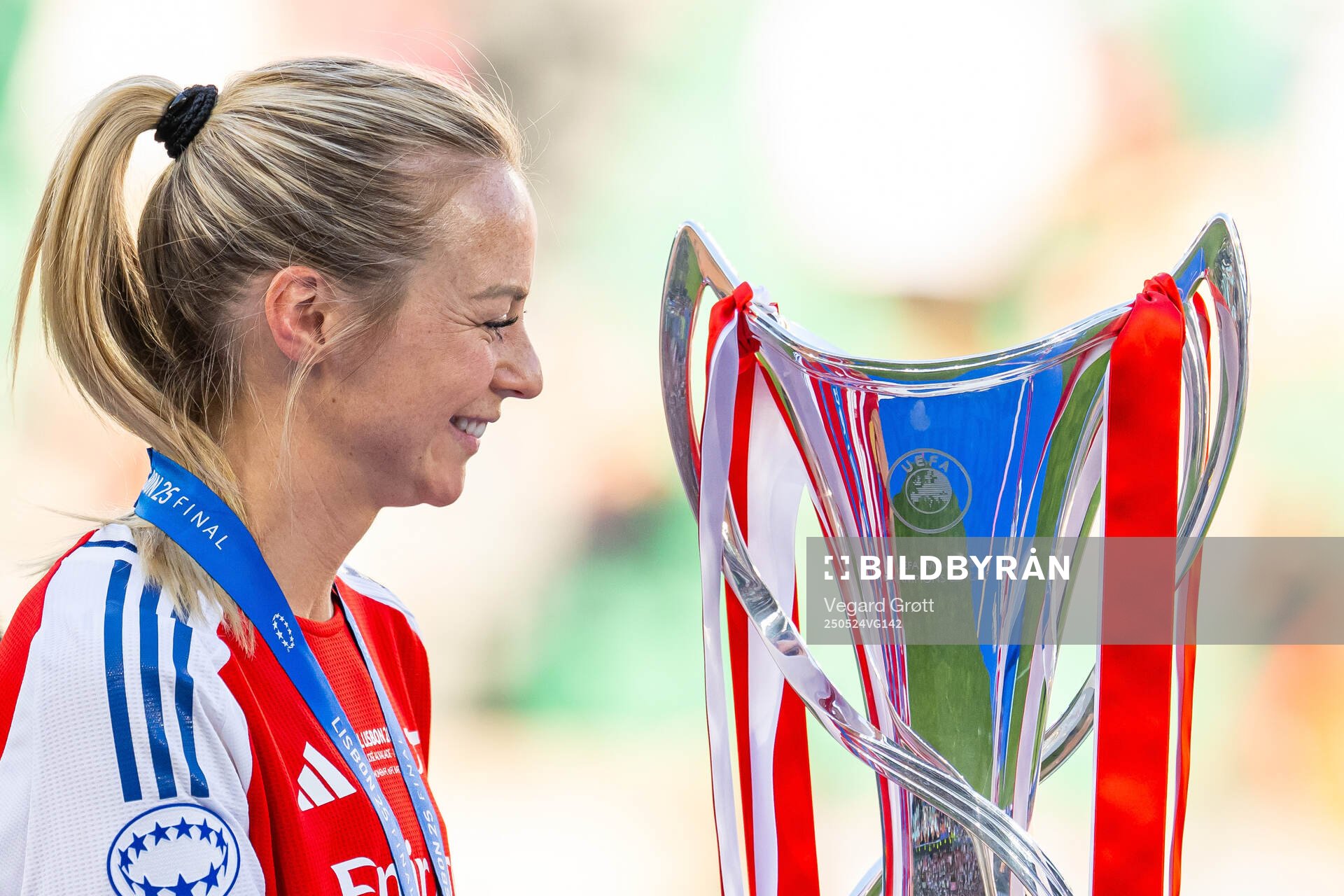 Amanda Ilestedt of Arsenal looks at the trophy after the UEFA Women's Champions League final match between Arsenal and Barcelona on May 24, 2025 in Lisbon.