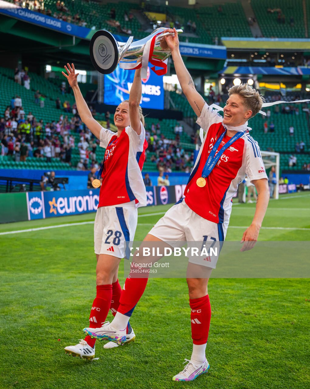Amanda Ilestedt and Lina Hurtig of Arsenal celebrate with the trophy after the UEFA Women's Champions League final match between Arsenal and Barcelona on May 24, 2025 in Lisbon.