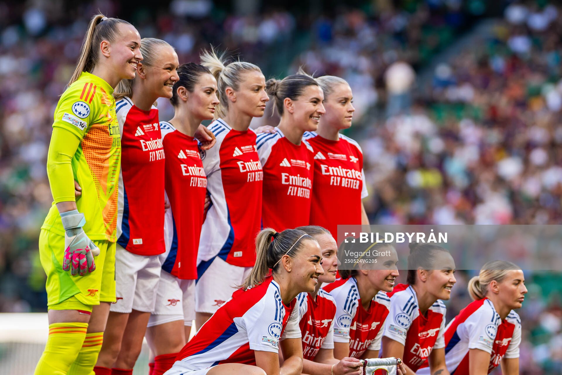 The starting eleven of Arsenal pose for a team photo ahead of the UEFA Women's Champions League final match between Arsenal and Barcelona on May 24, 2025 in Lisbon. Top left: goalkeeper Daphne van Domselaar, Frida Maanum, Emily Fox, Leah Williamson, Steph Catley and Alessia Russo. Front left: Katie McCabe, Kim Little, Mariona Caldentey, Caitlin Ford and Chloe Kelly.