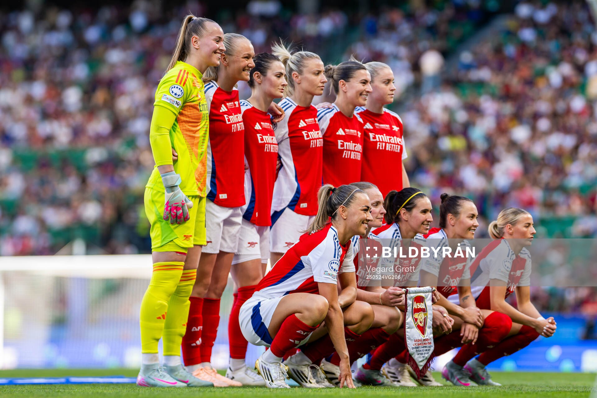 The starting eleven of Arsenal pose for a team photo ahead of the UEFA Women's Champions League final match between Arsenal and Barcelona on May 24, 2025 in Lisbon. Top left: goalkeeper Daphne van Domselaar, Frida Maanum, Emily Fox, Leah Williamson, Steph Catley and Alessia Russo. Front left: Katie McCabe, Kim Little, Mariona Caldentey, Caitlin Ford and Chloe Kelly.