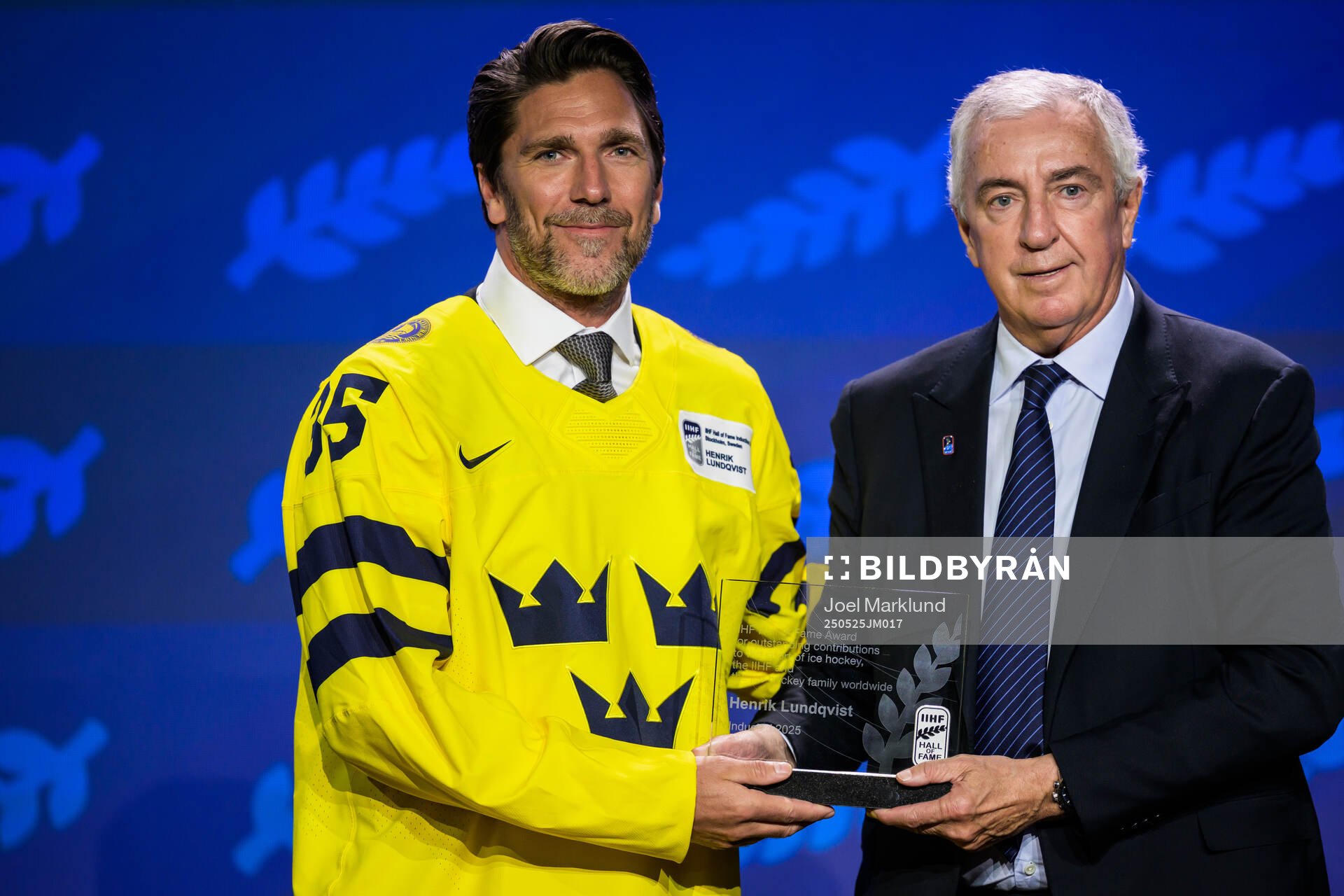 Henrik Lundqvist of Sweden and IIHF president Luc Tardif