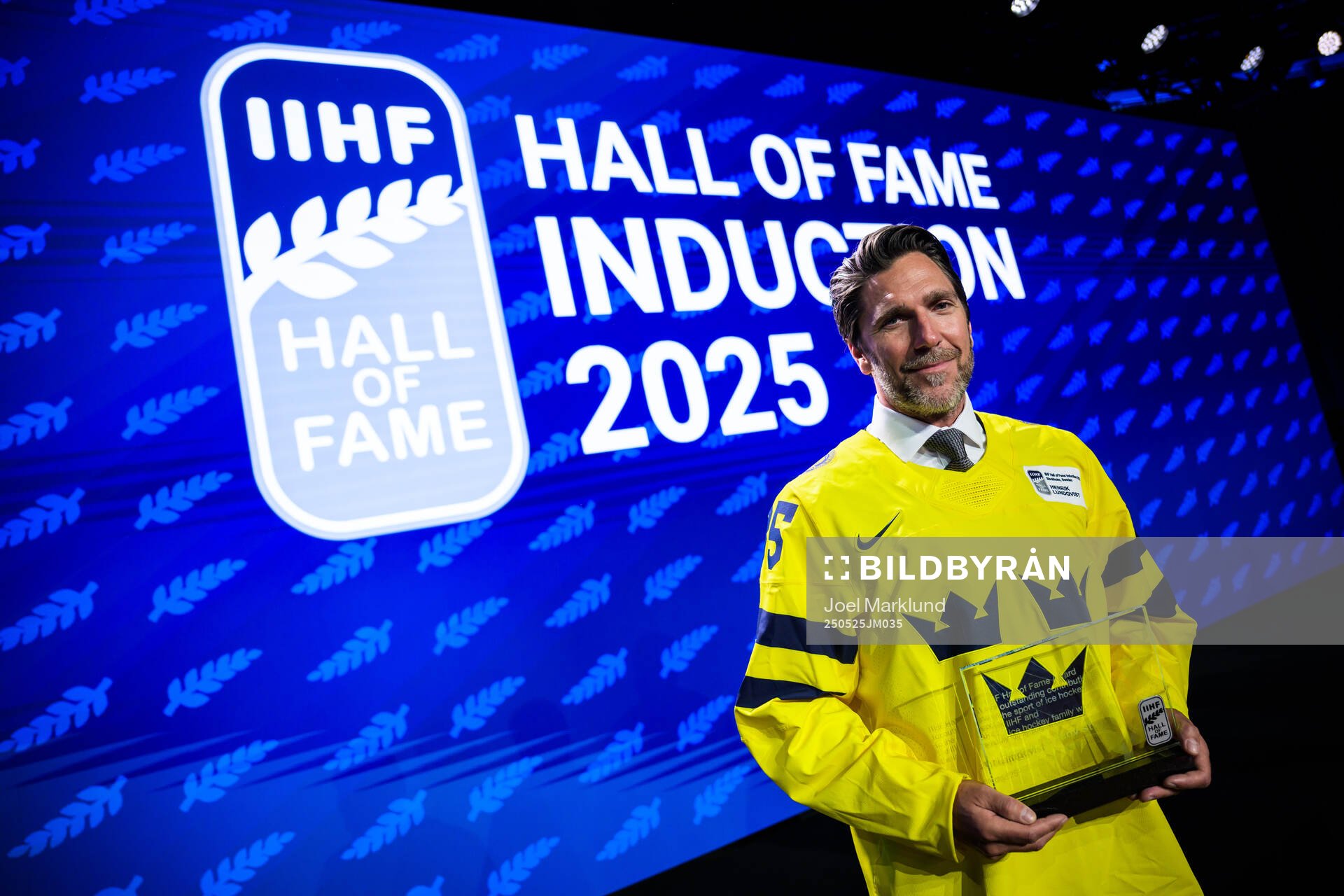 Henrik Lundqvist of Sweden poses with his induction trophy