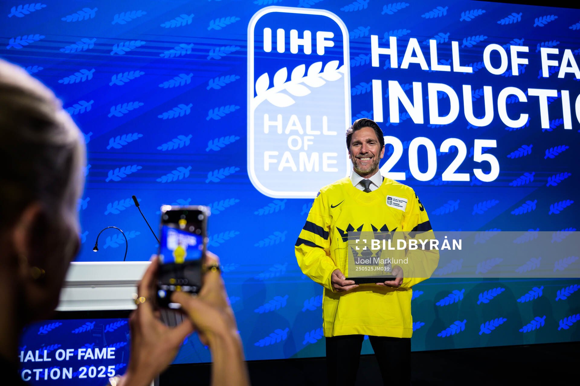 Henrik Lundqvist of Sweden poses with his induction trophy