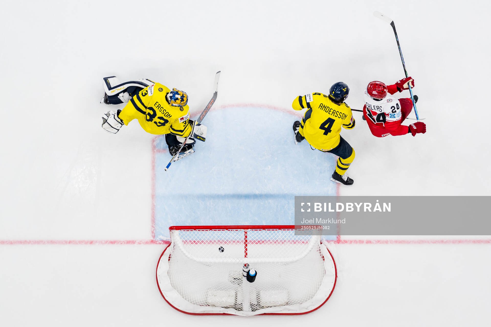Nikolaj Ehlers of Denmark scores 4-2 past goaltender Samuel
