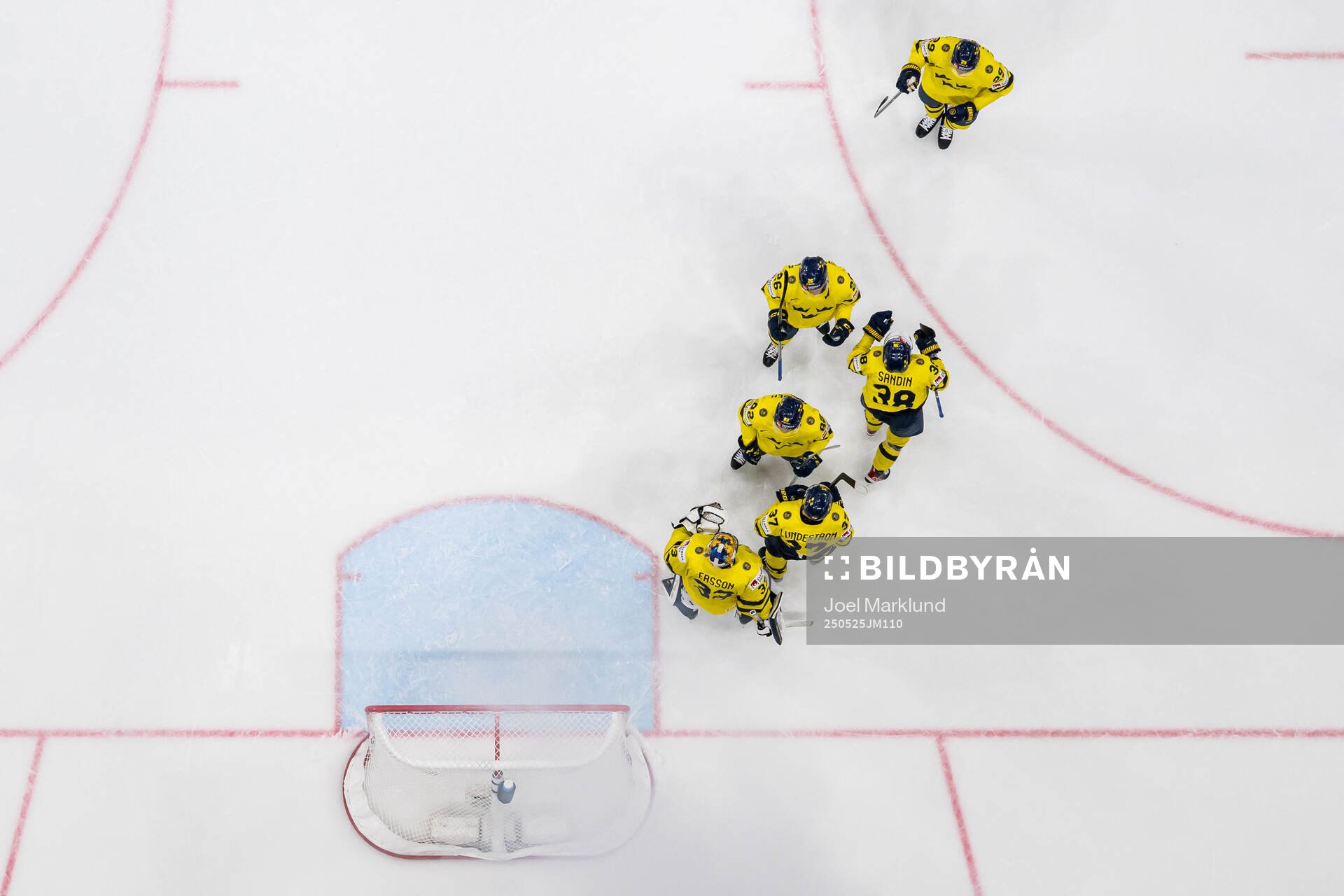 goaltender Samuel Ersson of Sweden with team mates