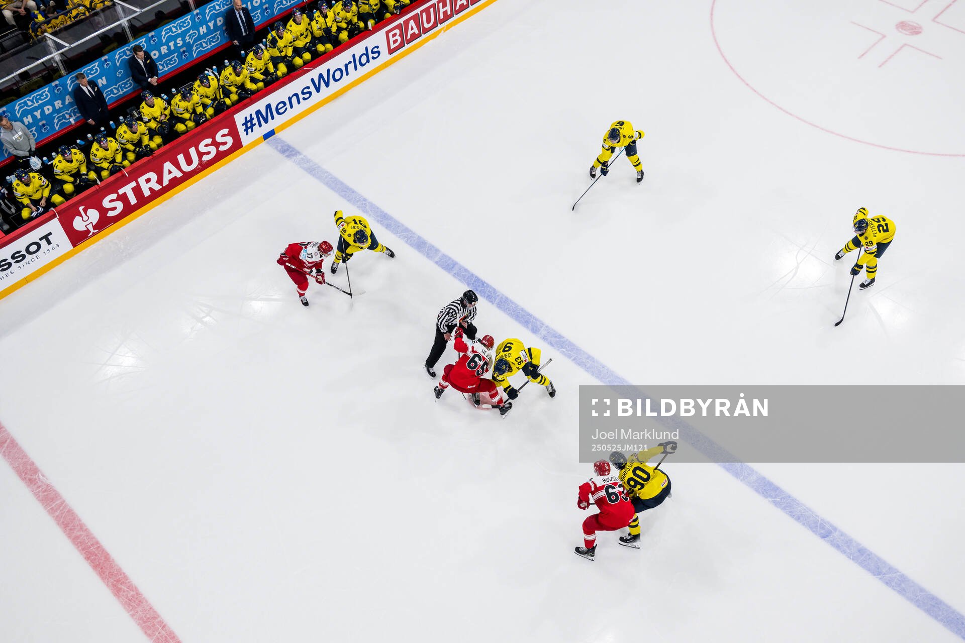 Christian Wejse of Denmark face off with Mika Zibanejad of